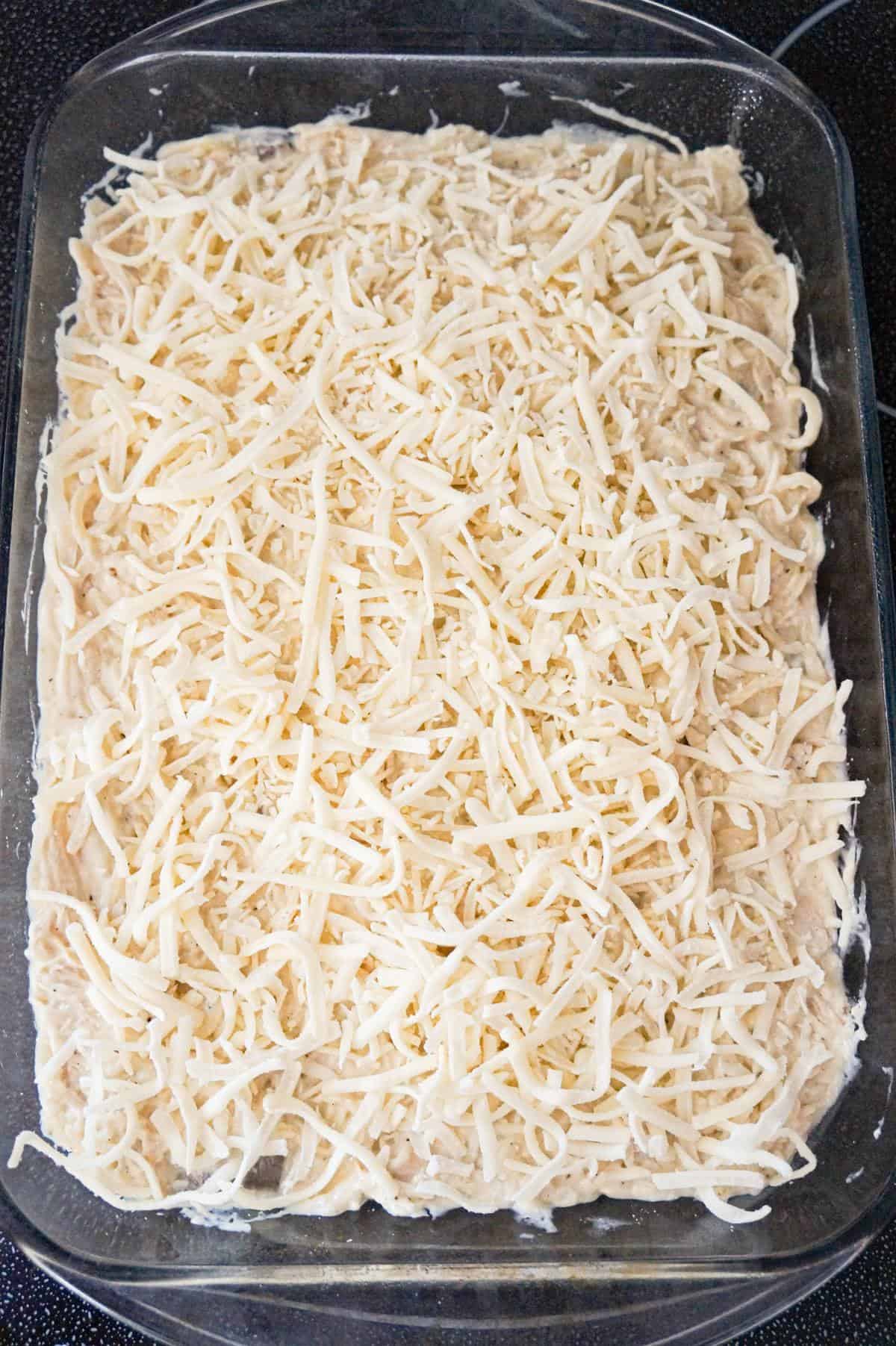 shredded mozzarella on top of chicken spaghetti before baking