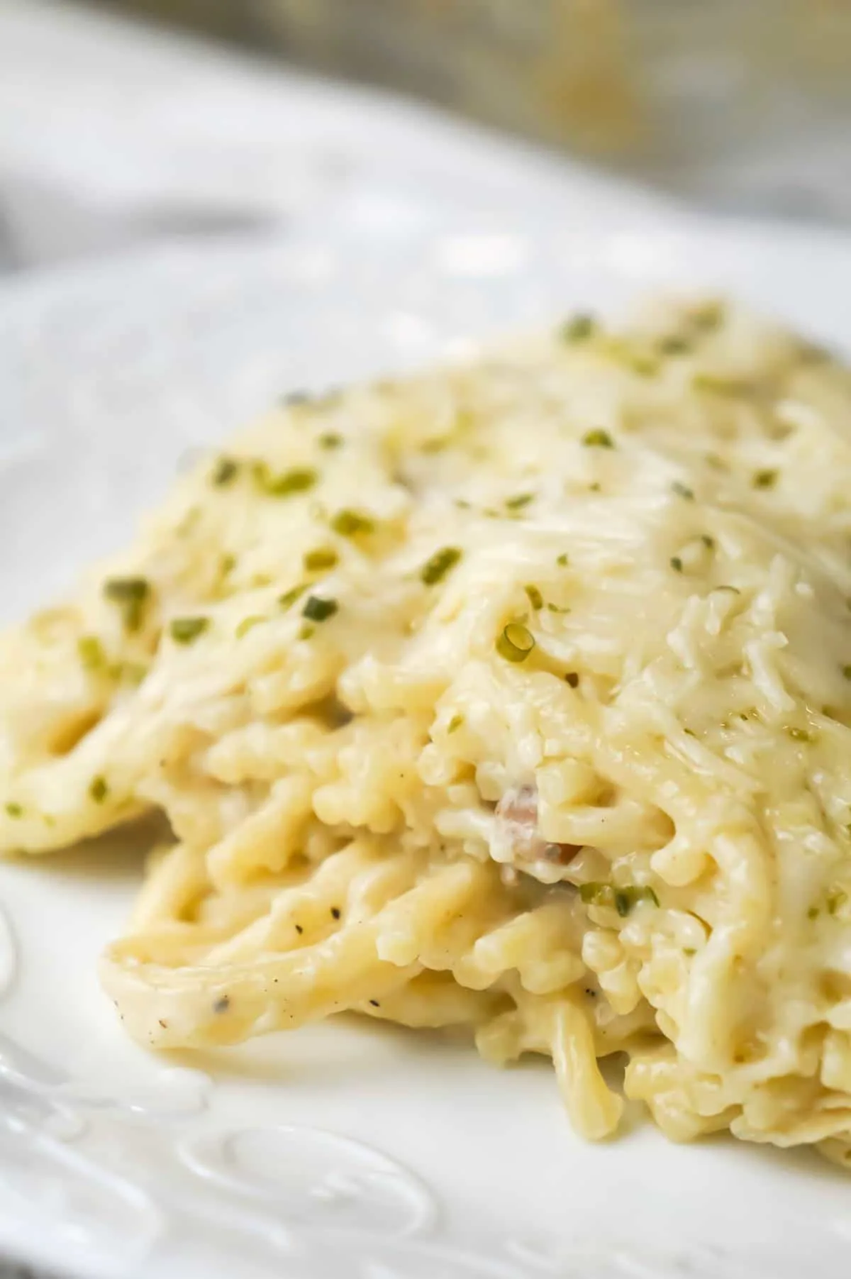 Chicken Tetrazzini is a creamy baked pasta dish loaded with shredded chicken, Parmesan and Mozzarella cheese.