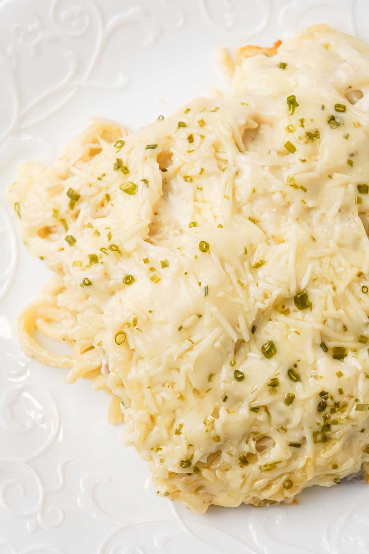 Chicken Tetrazzini is a creamy baked pasta dish loaded with shredded chicken, Parmesan and Mozzarella cheese.