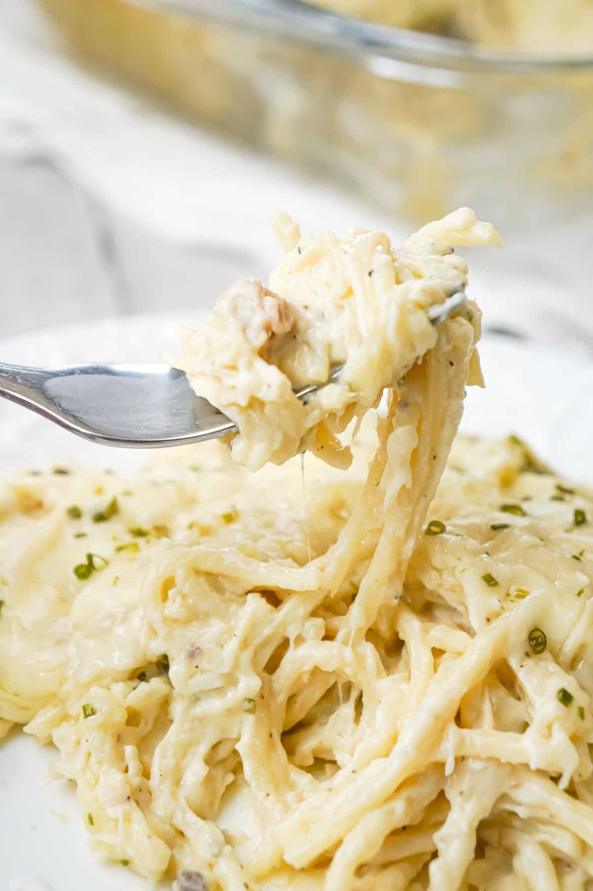 Chicken Tetrazzini is a creamy baked pasta dish loaded with shredded chicken, Parmesan and Mozzarella cheese.