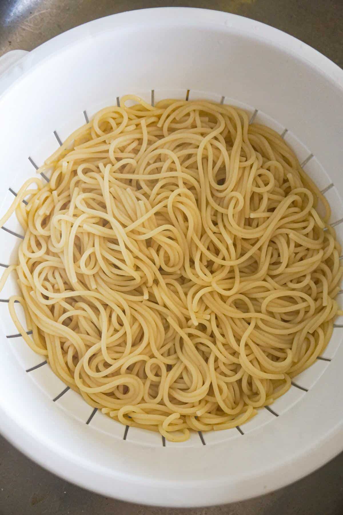 spaghetti in a colander 