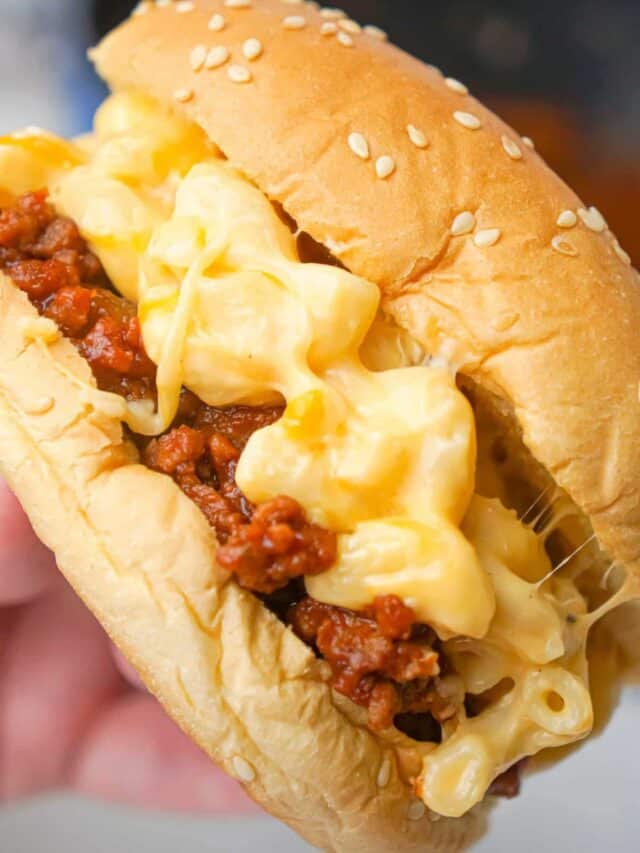 Mac and Cheese Sloppy Joes are hearty ground beef sandwiches topped with macaroni and cheese.