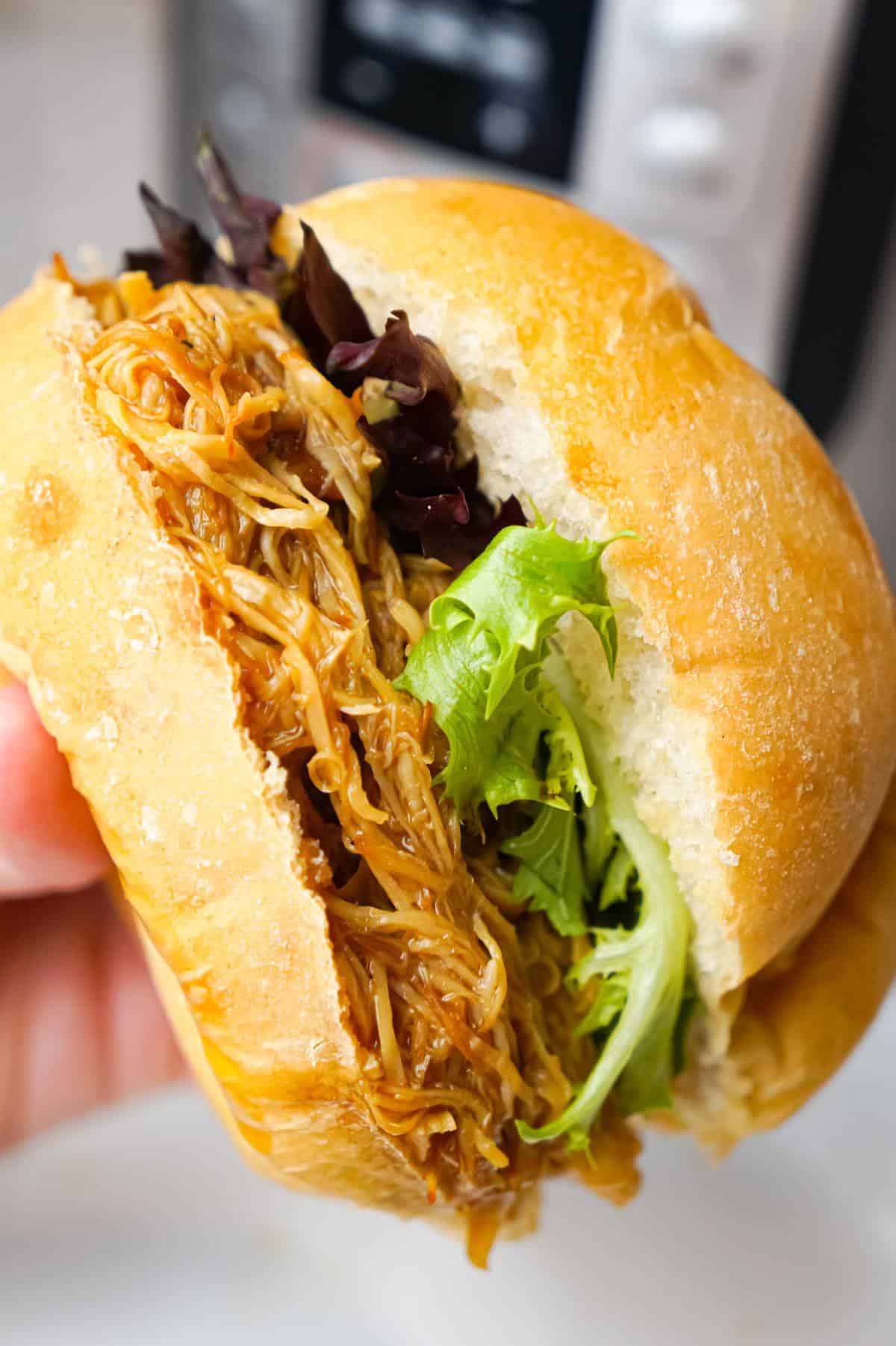 Instant Pot Honey Garlic Chicken Sandwiches are an easy pressure cooker chicken dinner recipe using boneless, skinless chicken breasts cooked in a homemade honey garlic sauce.