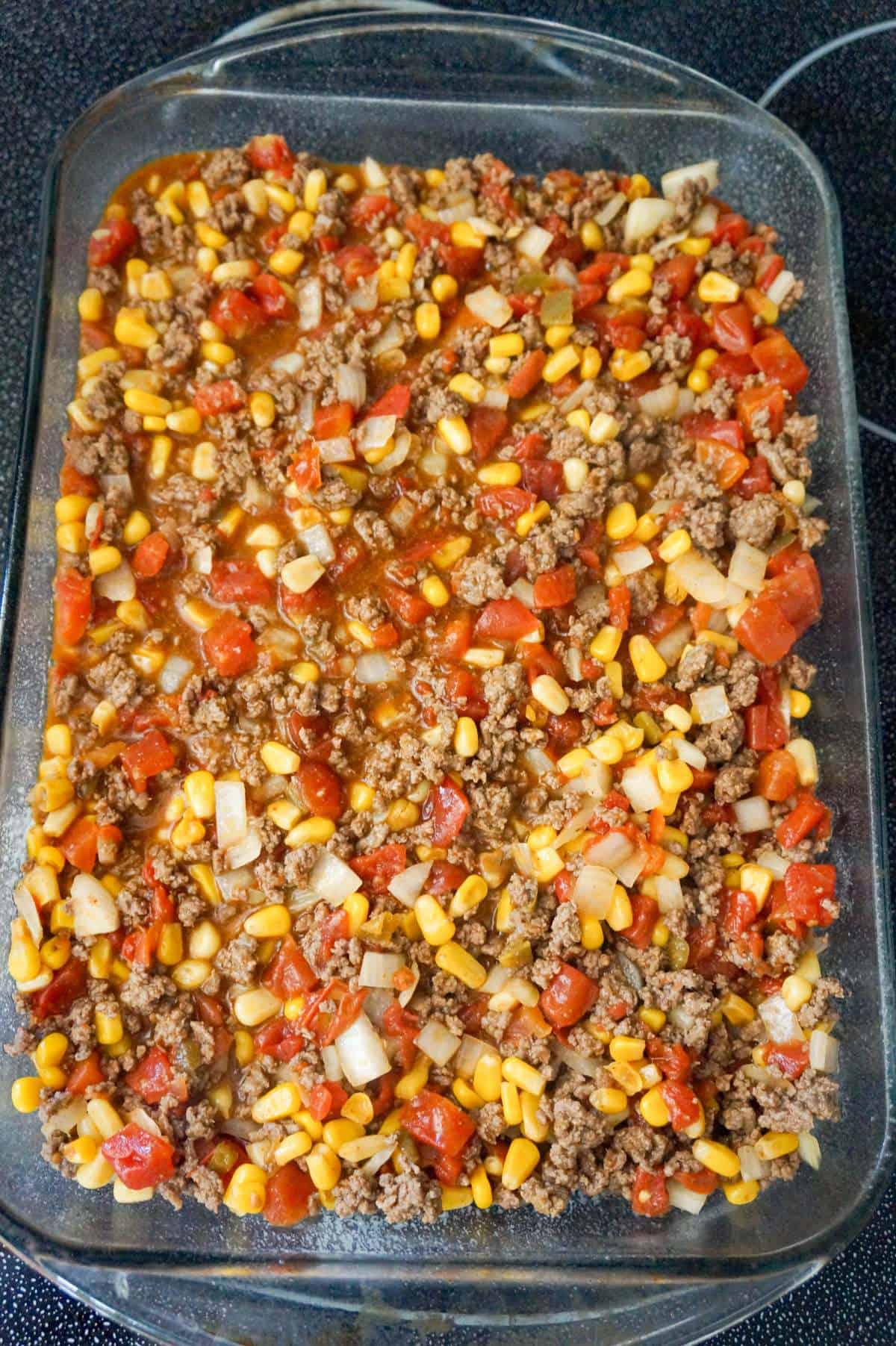 ground beef, corn and diced tomato mixture in a baking dish