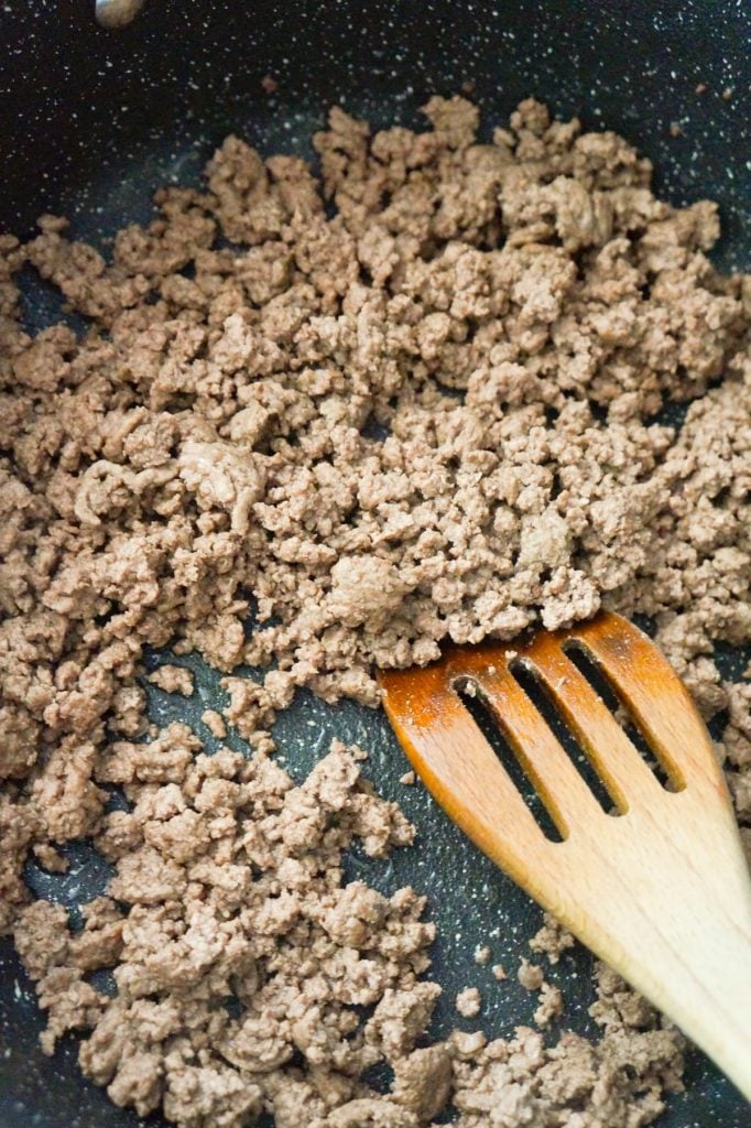 cooked ground beef in a saute pan