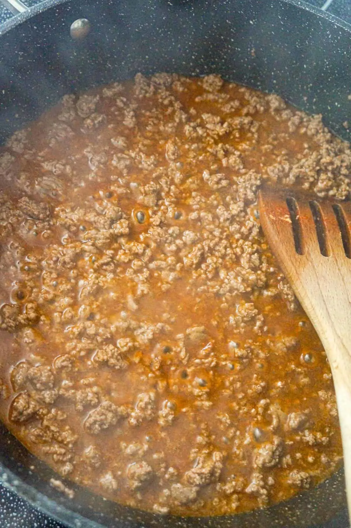 water, taco seasoning and ground beef in a large saute pan