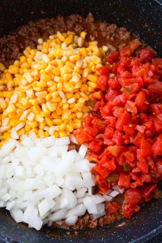 diced onions, Rotel, corn and ground beef in a large saute pan