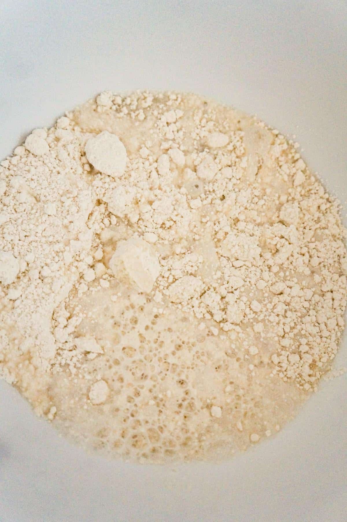 water and Bisquick mix in a mixing bow
