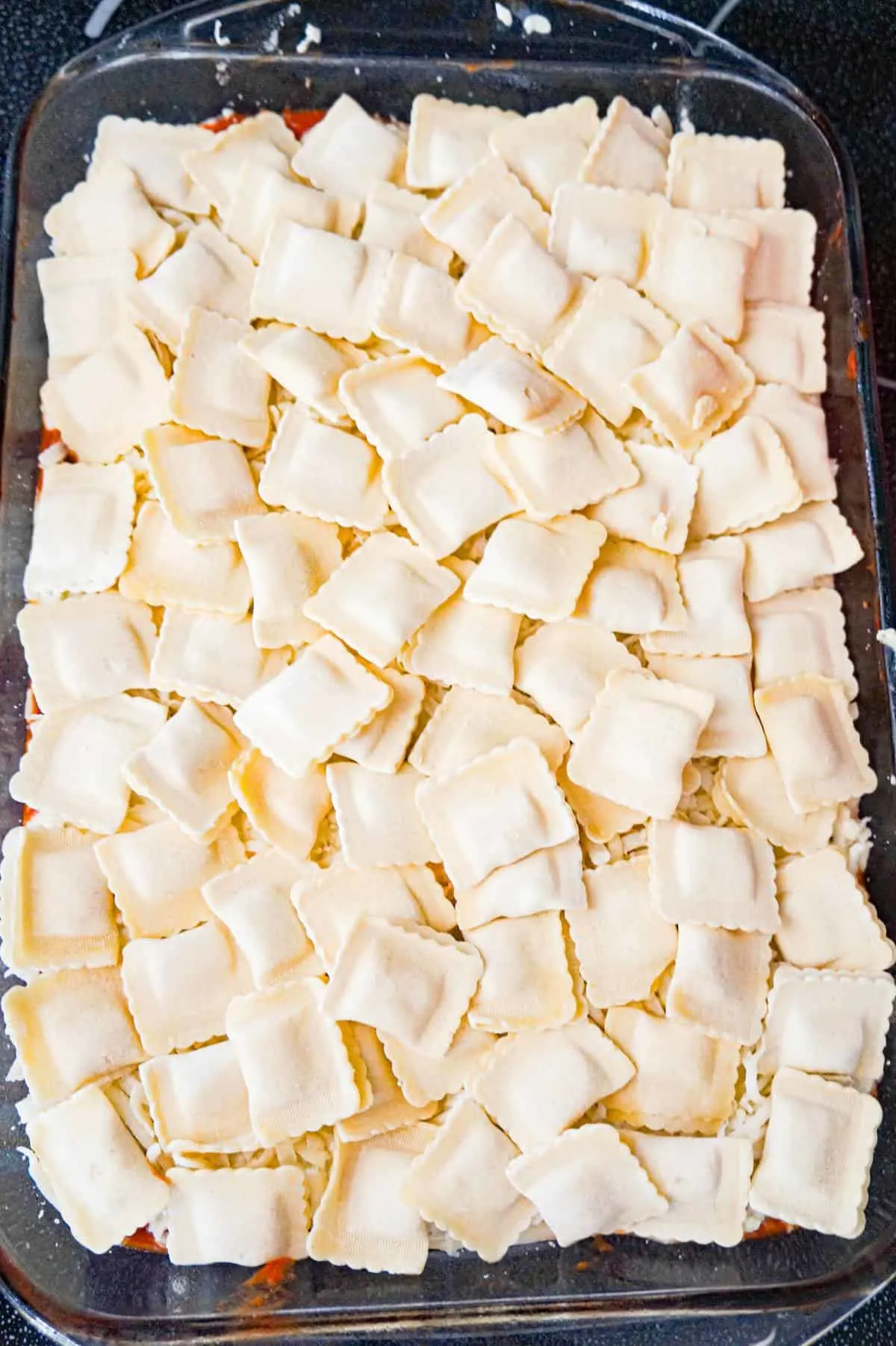 frozen cheese ravioli in a baking dish