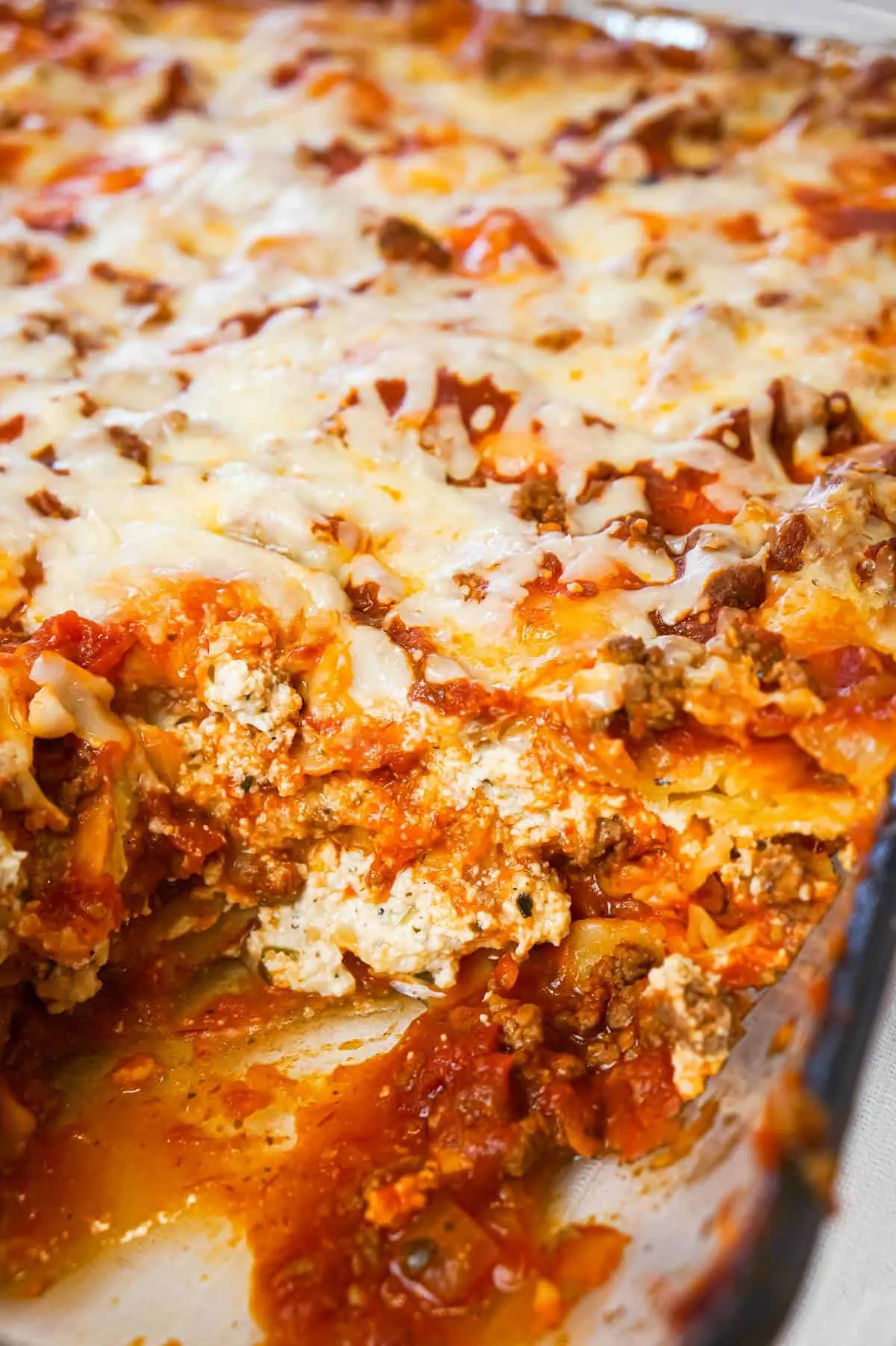 Lasagna with Ravioli is a simple and delicious twist on traditional lasagna made with frozen cheese ravioli, ground beef, marinara, ricotta and mozzarella cheese.