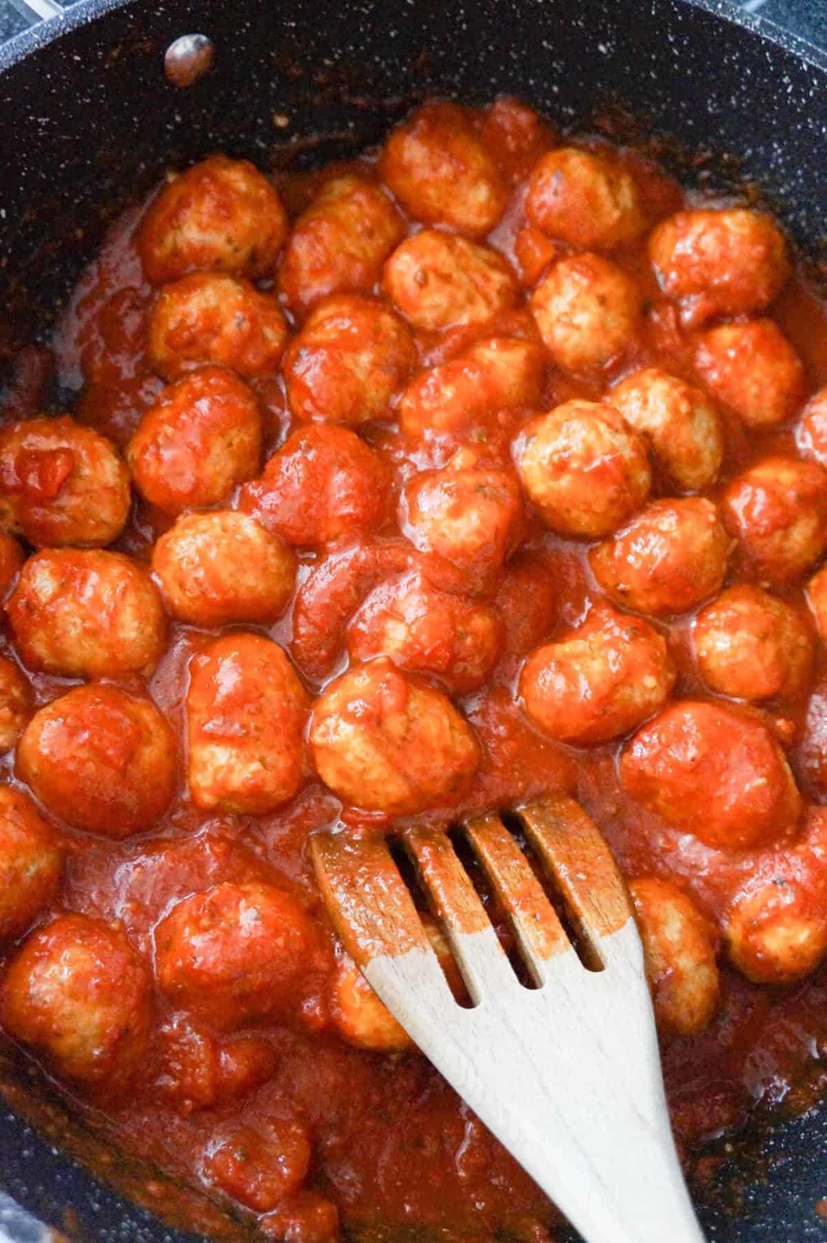 meatballs and marinara in a saute pan