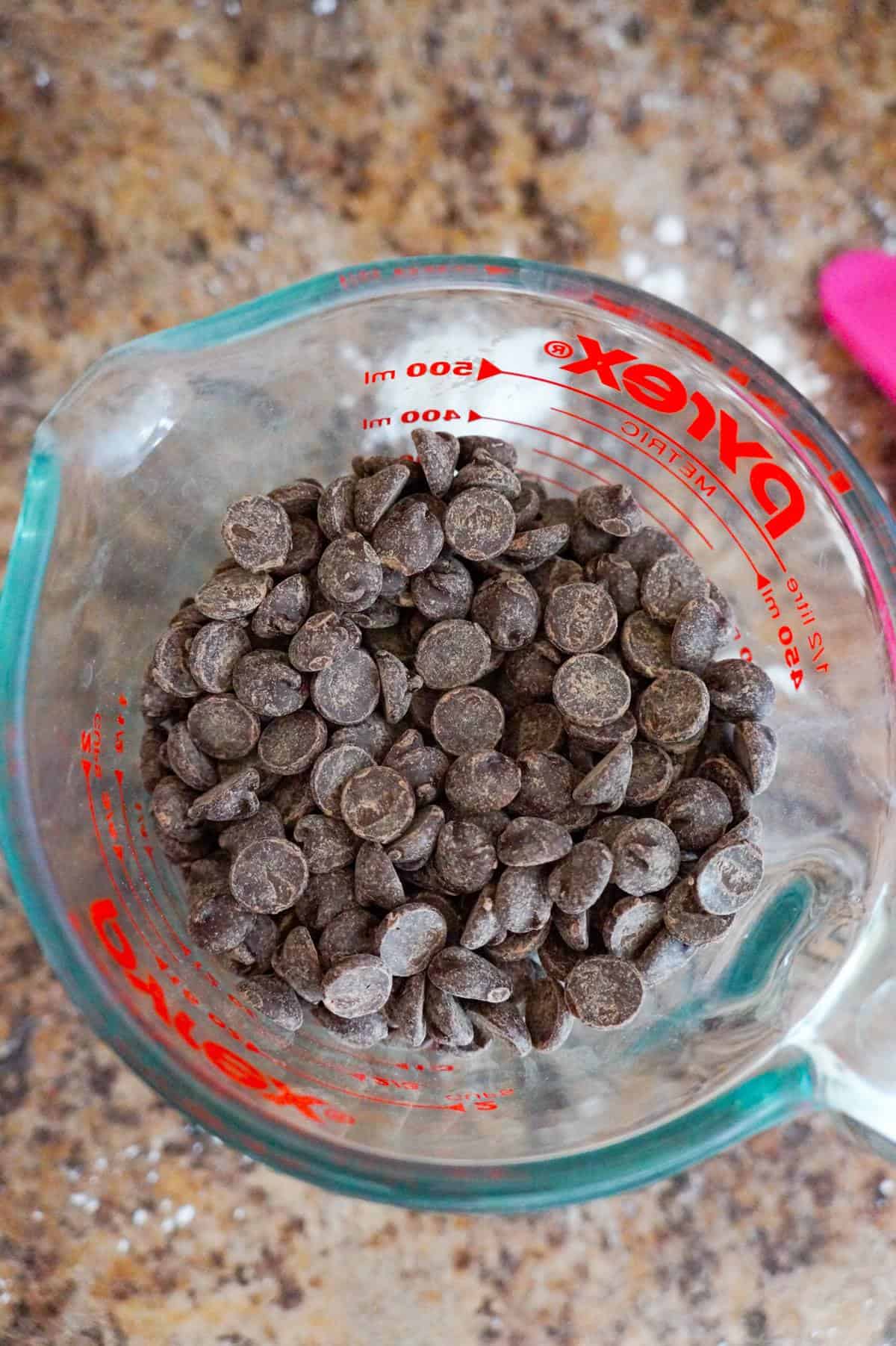 semi sweet chocolate chips in a glass measuring cup