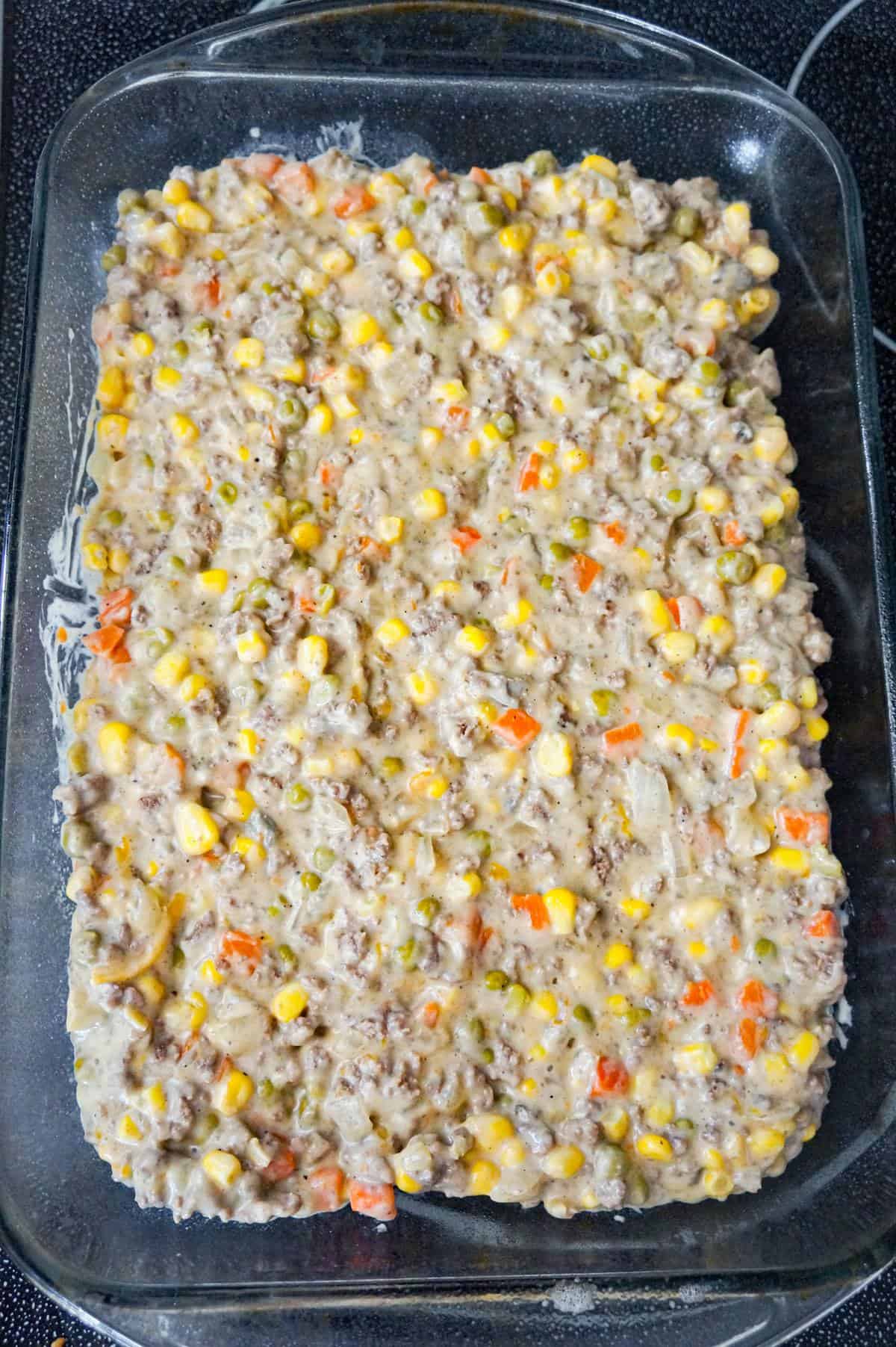 creamy ground beef and veggie mixture in a baking dish