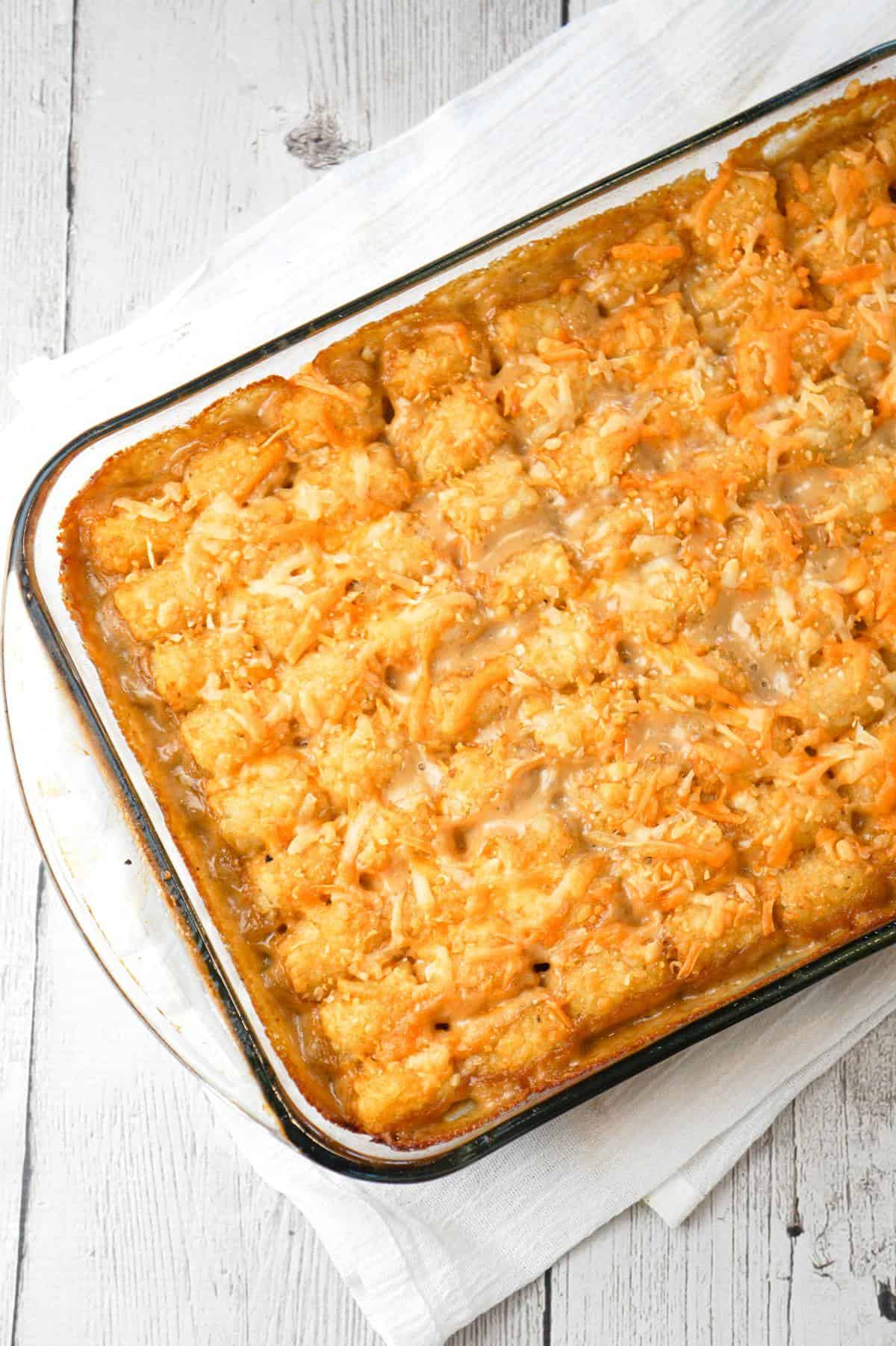 Tater Tot Hotdish is an easy ground beef casserole recipe loaded with canned veggies, cream of mushroom soup, cheddar cheese and topped with tater tots.