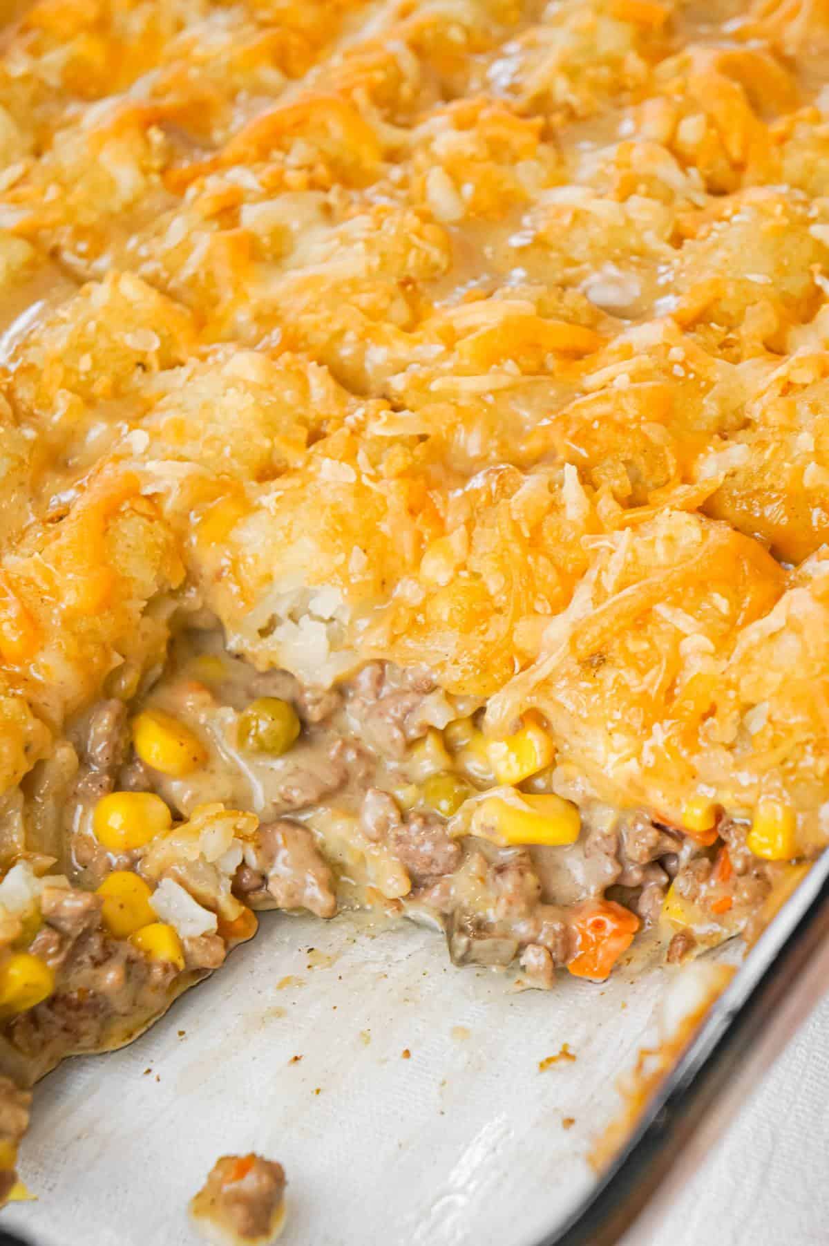 Tater Tot Hotdish is an easy ground beef casserole recipe loaded with canned veggies, cream of mushroom soup, cheddar cheese and topped with tater tots.