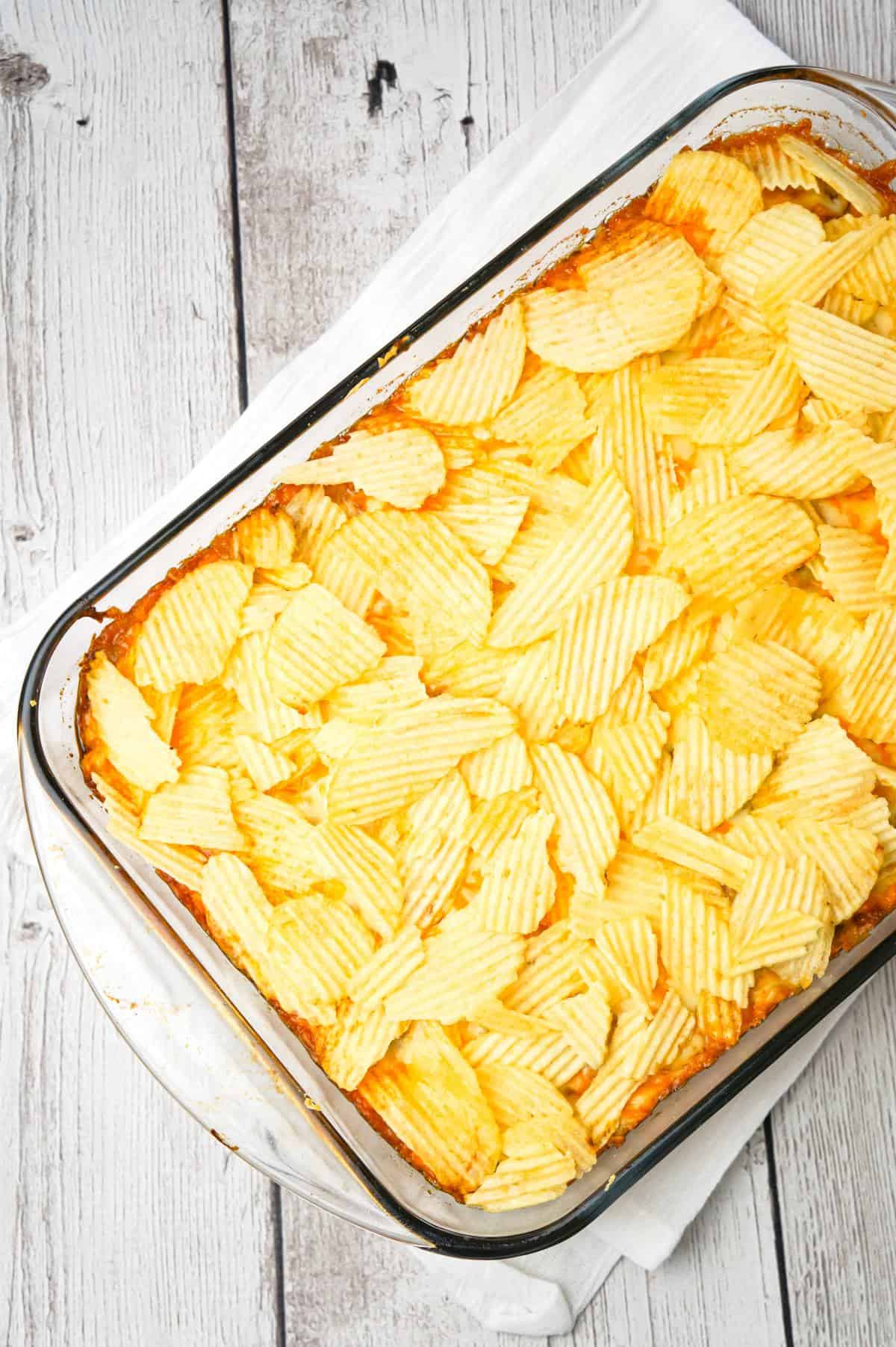 Cheeseburger Casserole with Potato Chips is an easy ground beef dinner recipe with a Bisquick base loaded with hamburger meat, diced onions, tomatoes and cheese all topped with ruffled potato chips.