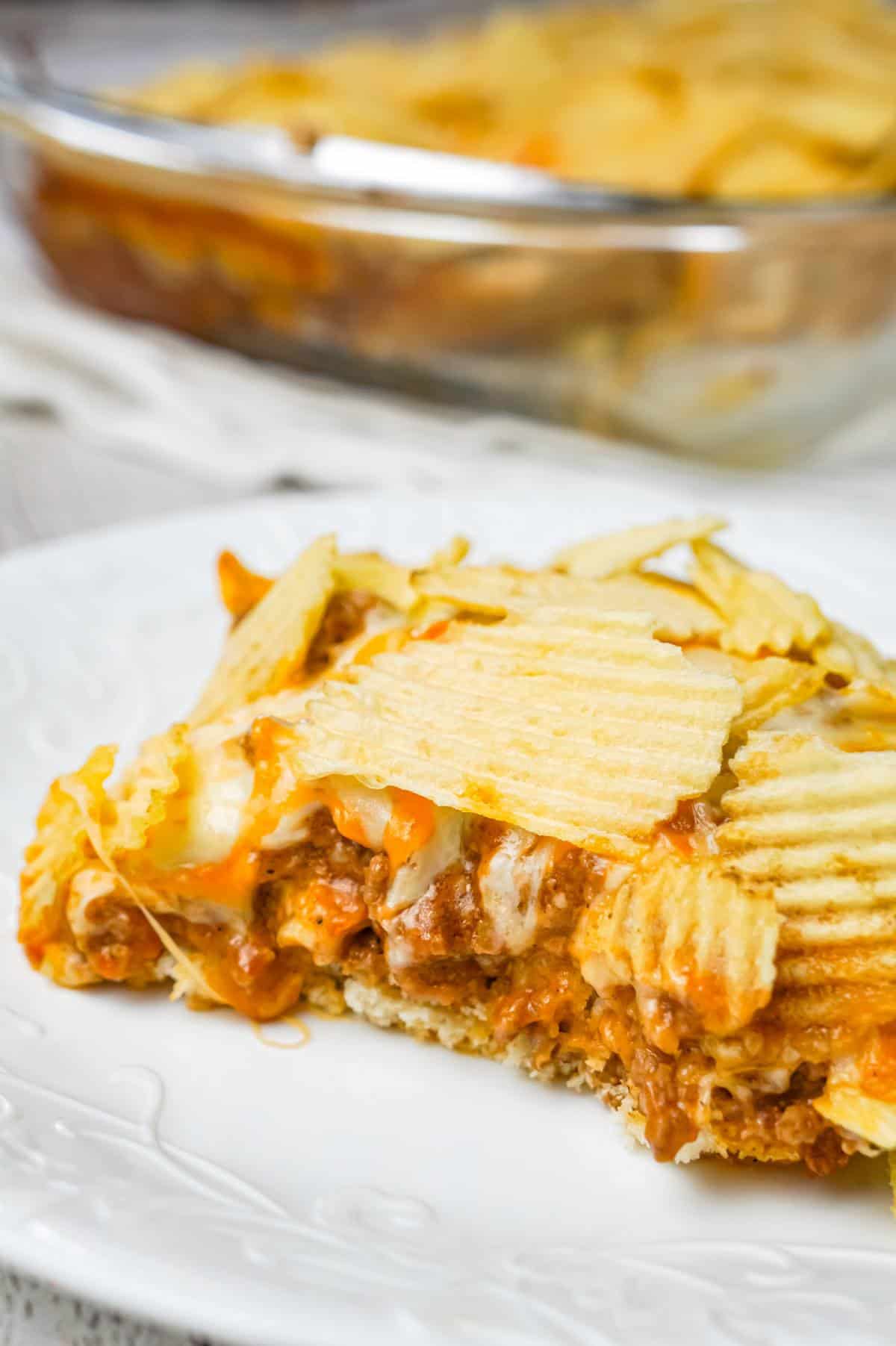 Cheeseburger Casserole with Potato Chips is an easy ground beef dinner recipe with a Bisquick base loaded with hamburger meat, diced onions, tomatoes and cheese all topped with ruffled potato chips.