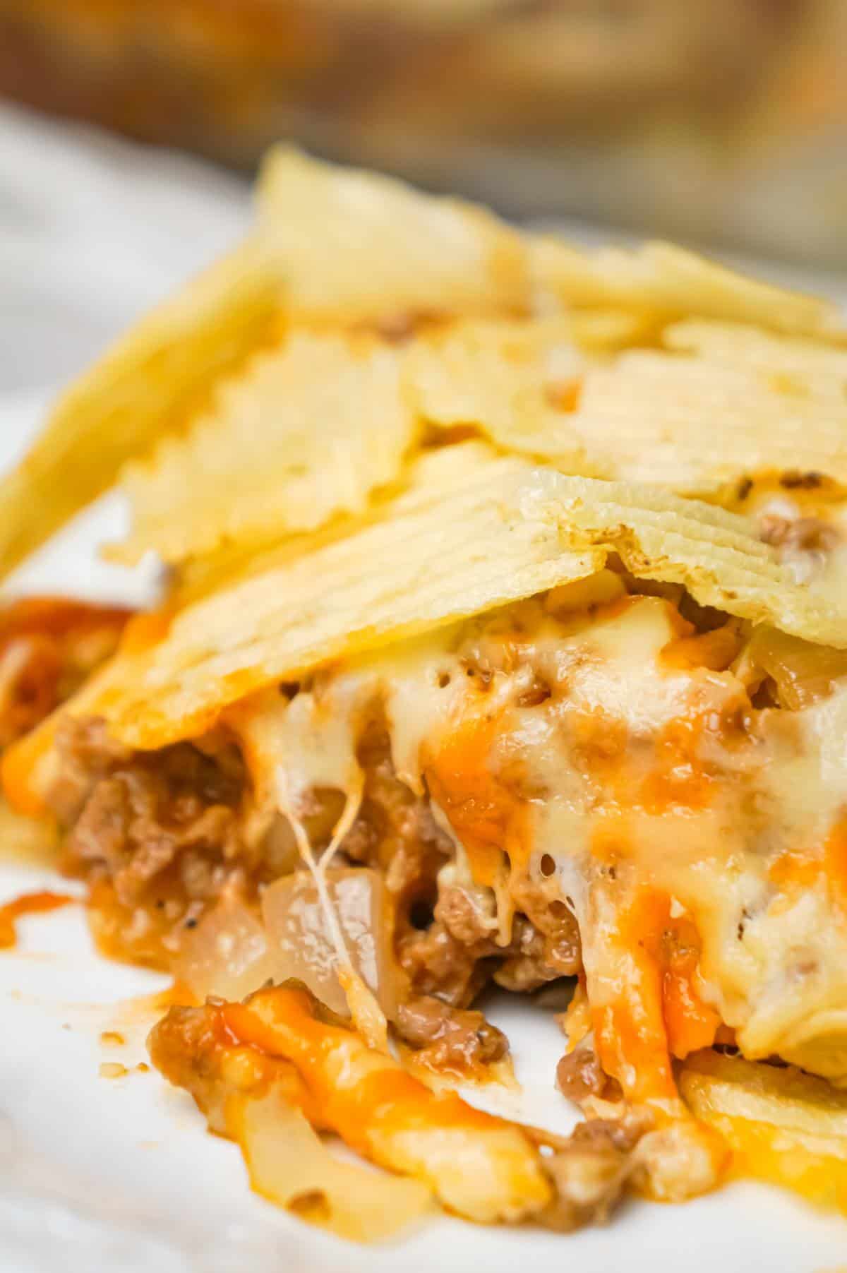 Cheeseburger Casserole with Potato Chips is an easy ground beef dinner recipe with a Bisquick base loaded with hamburger meat, diced onions, tomatoes and cheese all topped with ruffled potato chips.
