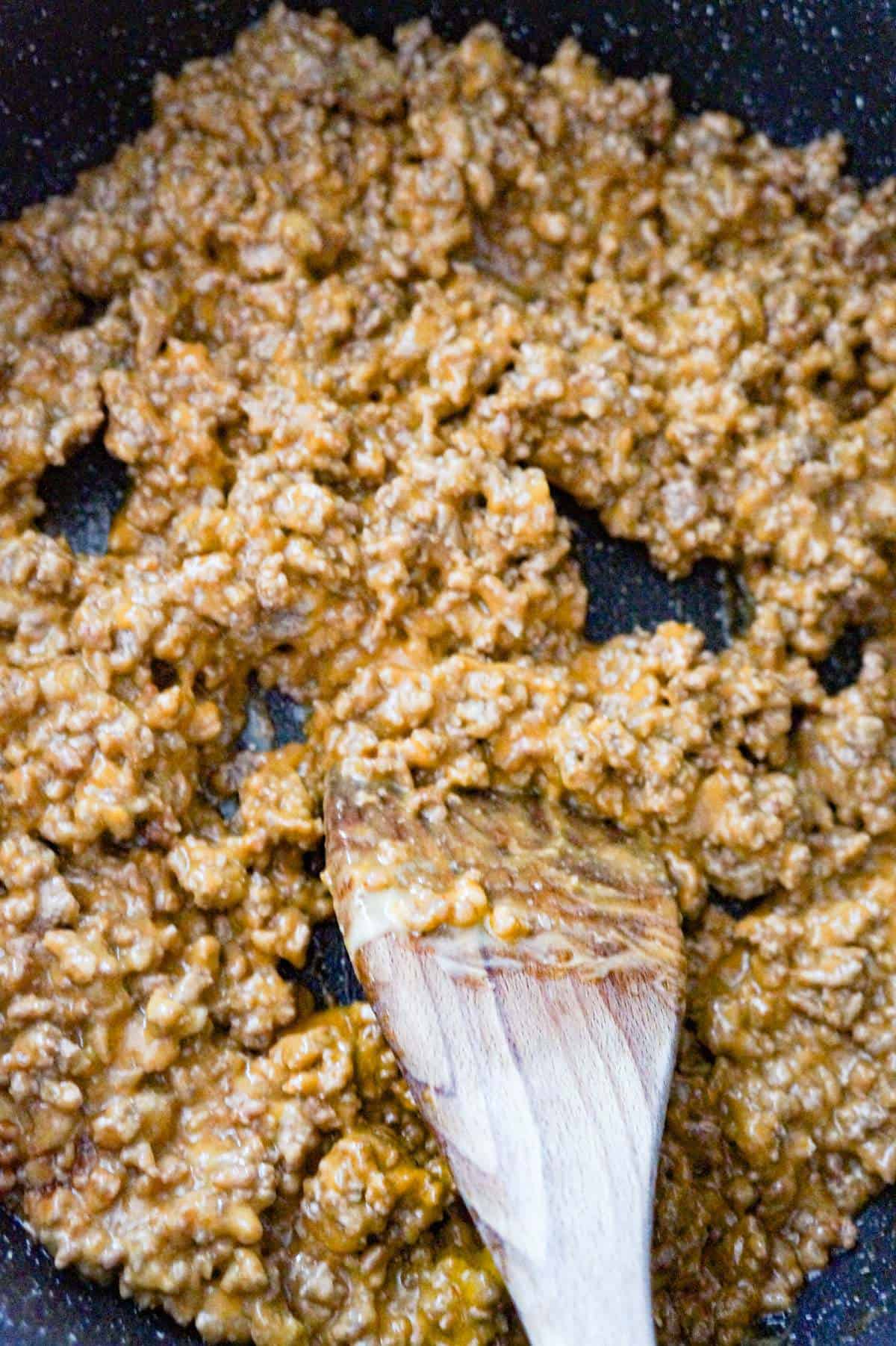 ground beef and cheese soup mixture in a saute pan