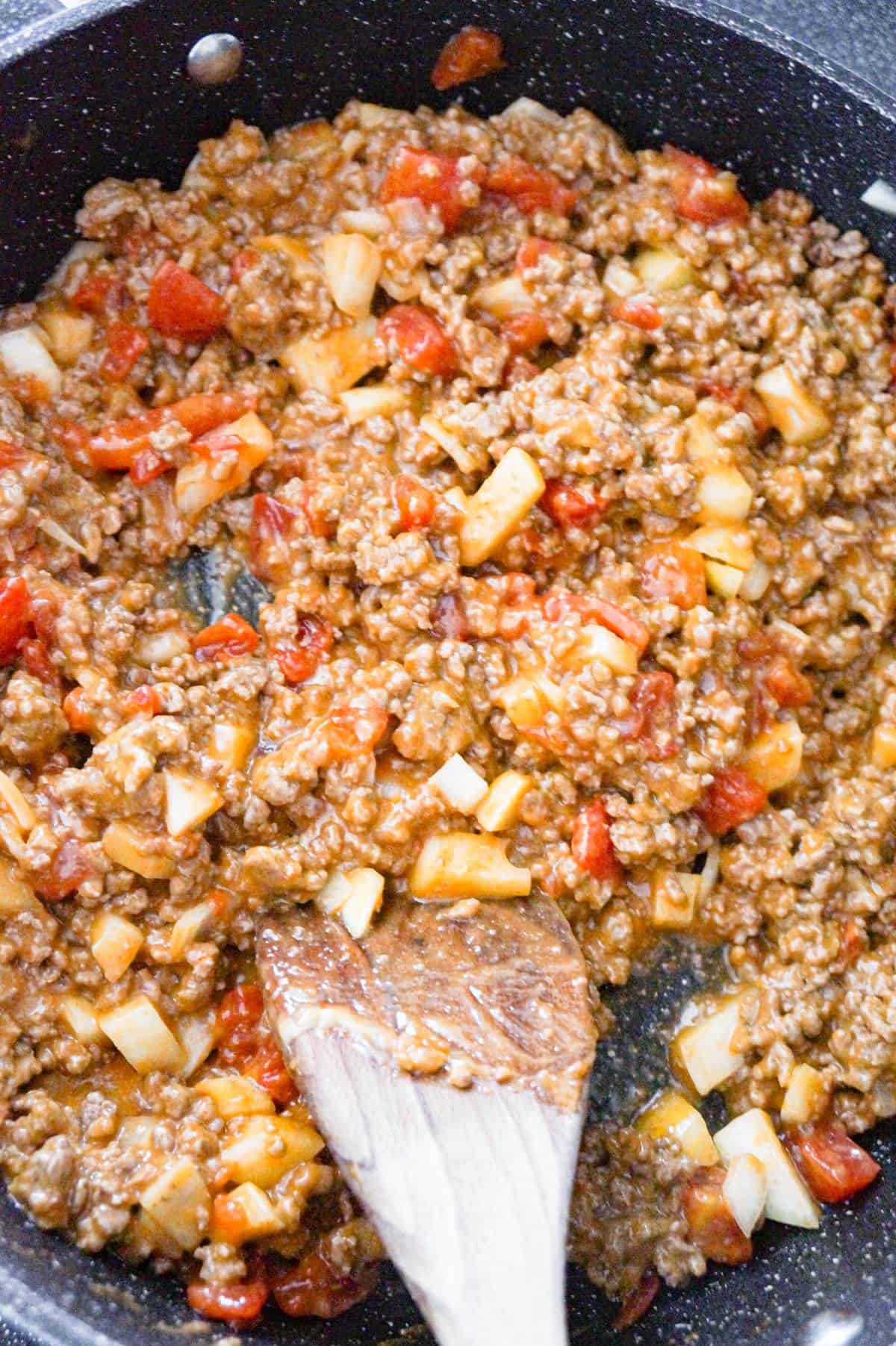 ground beef, diced tomato and cheese soup mixture in a saute pan