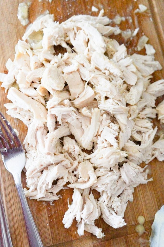 shredded chicken on a cutting board