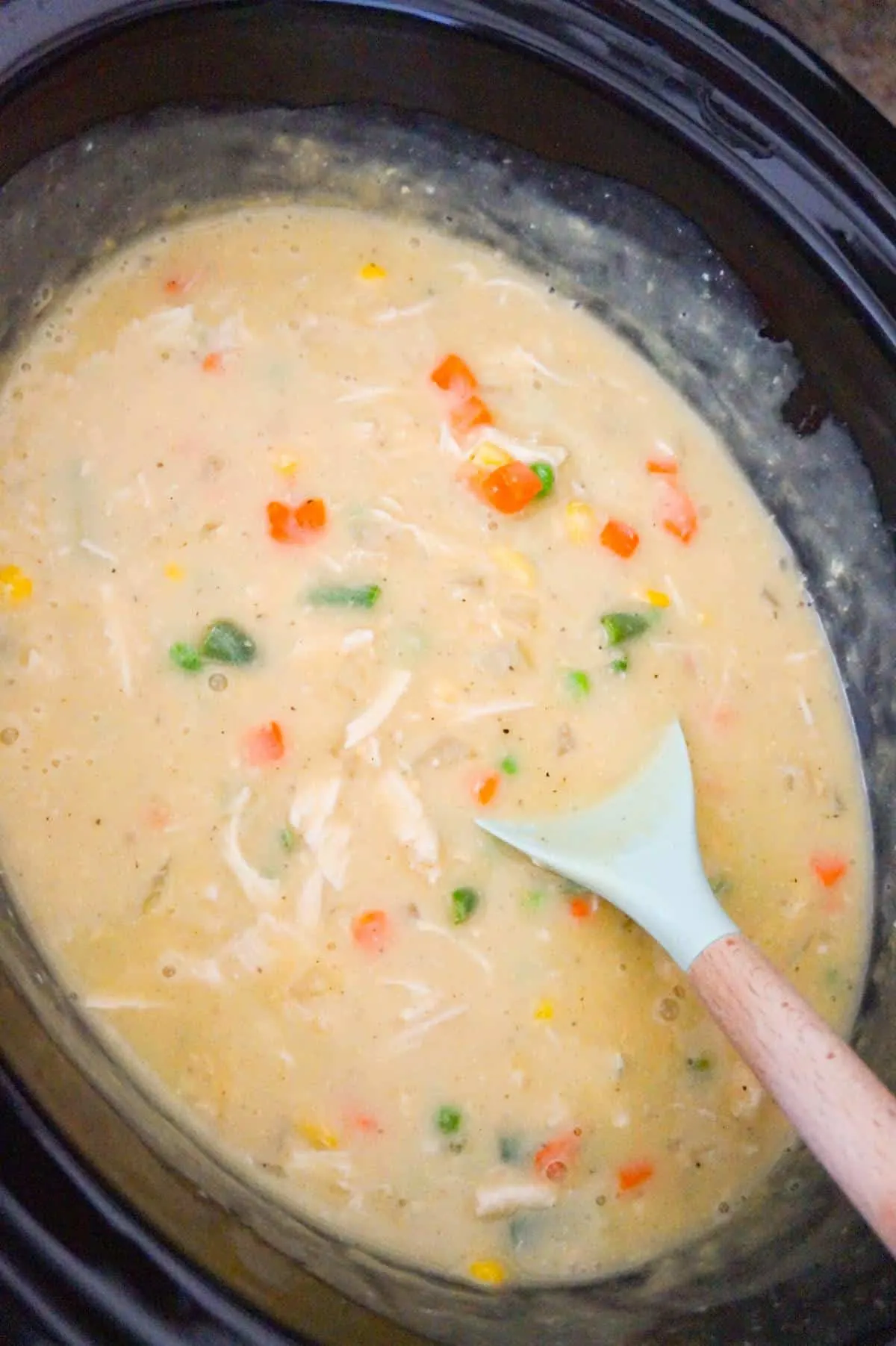 creamy chicken and vegetable mixture in a crock pot