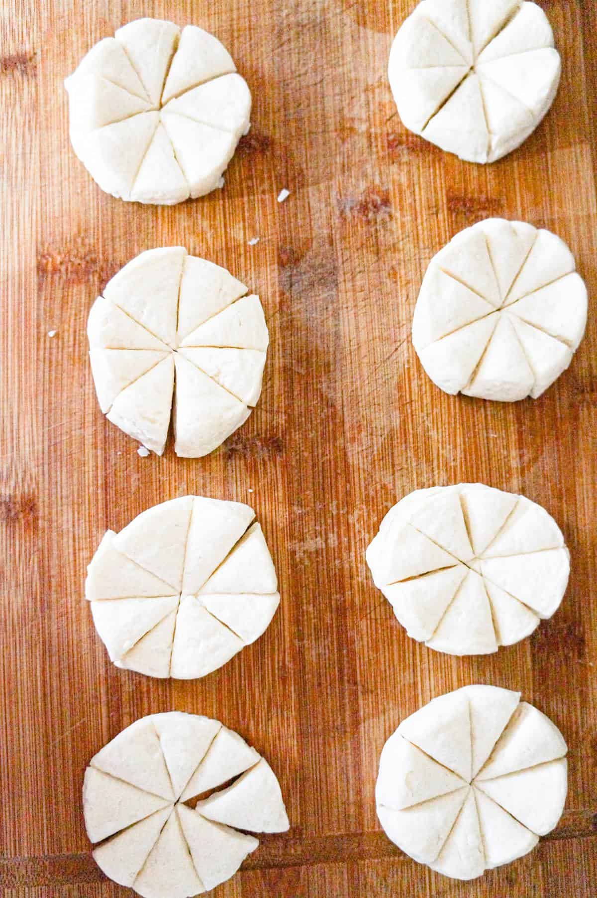 raw Pillsbury biscuits cut into 8 pieces