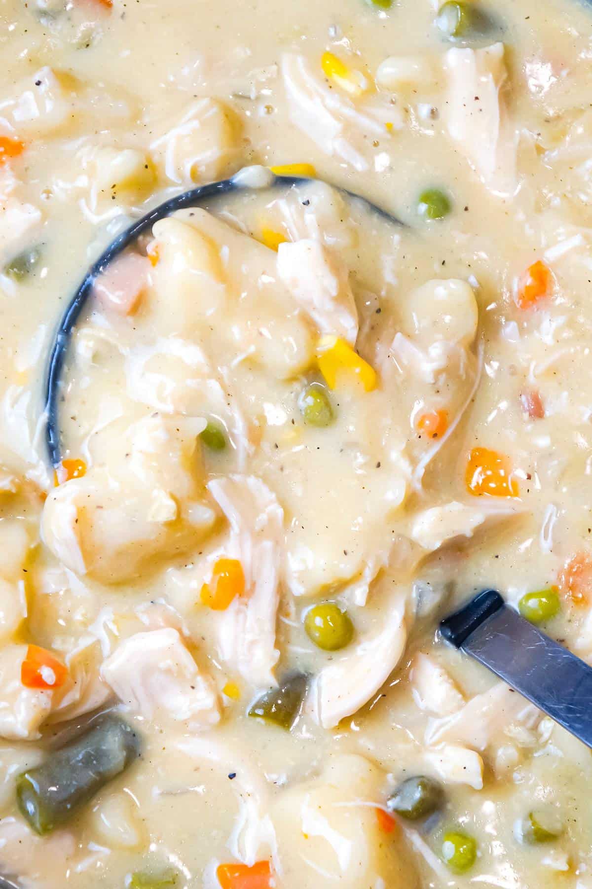 Crock Pot Chicken and Dumplings is an easy slow cooker dinner recipe loaded with chicken breast, veggies and Pillsbury biscuit dough dumplings all in a creamy sauce.