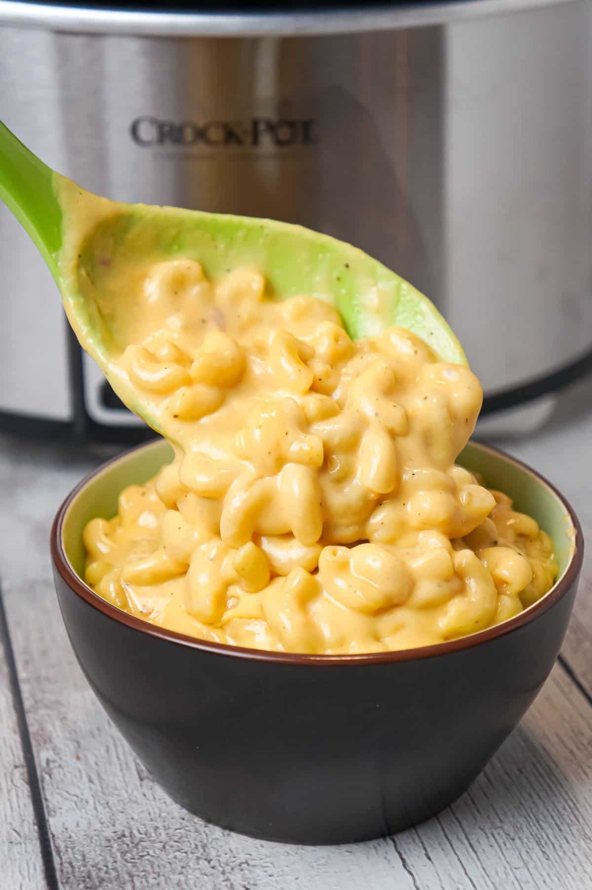 Crock Pot Mac and Cheese is an easy macaroni and cheese recipe made with condensed cheddar cheese soup, heavy cream and shredded mozzarella and cheddar cheese.