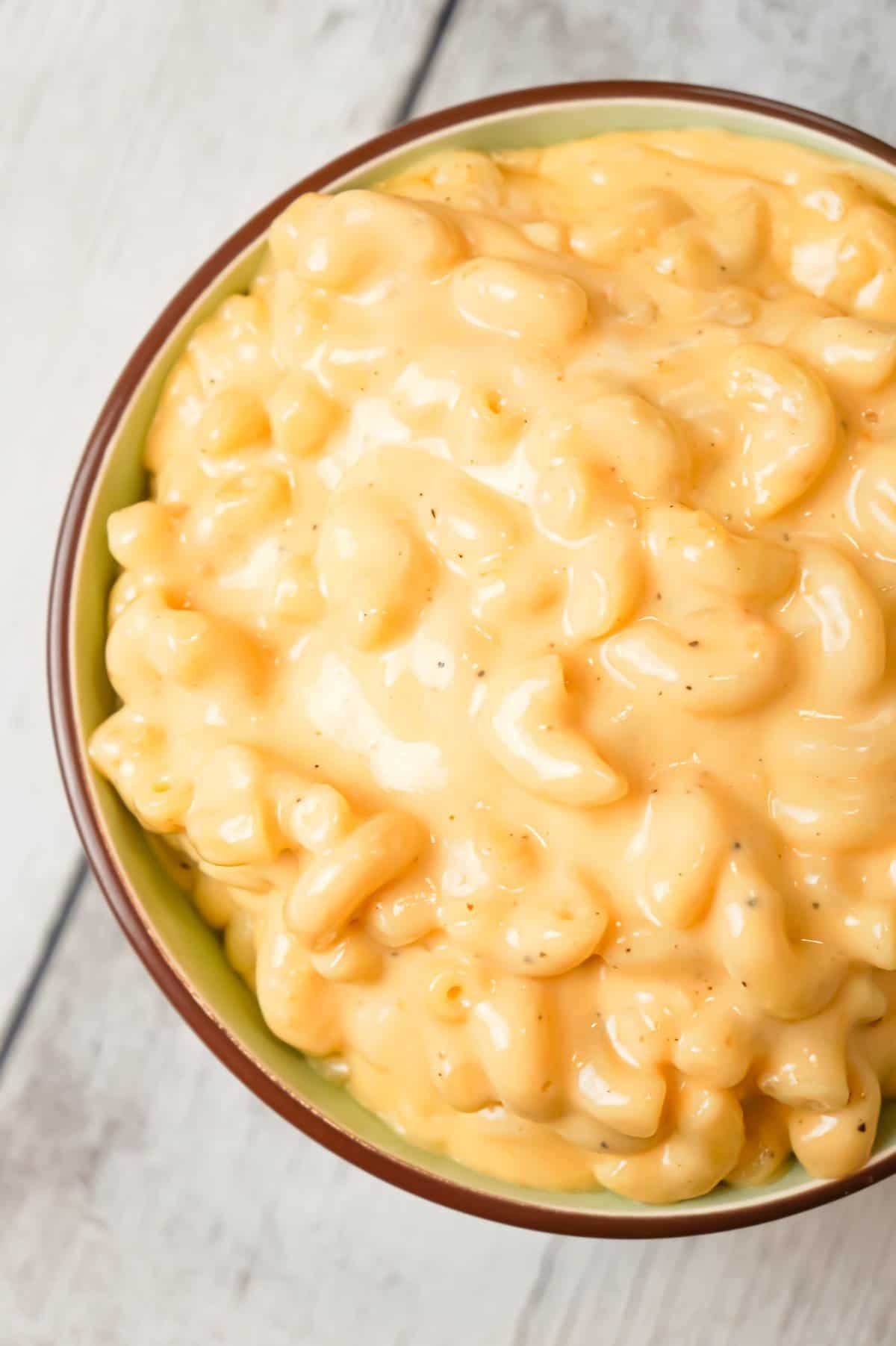 Crock Pot Mac and Cheese is an easy macaroni and cheese recipe made with condensed cheddar cheese soup, heavy cream and shredded mozzarella and cheddar cheese.