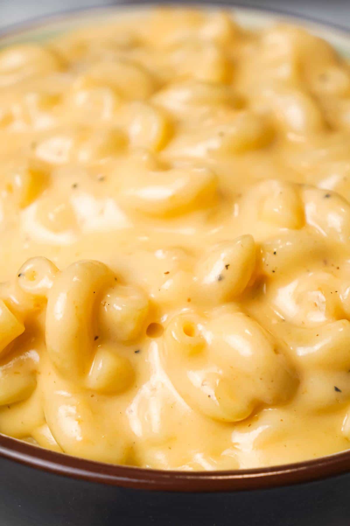 Crock Pot Mac and Cheese is an easy macaroni and cheese recipe made with condensed cheddar cheese soup, heavy cream and shredded mozzarella and cheddar cheese.