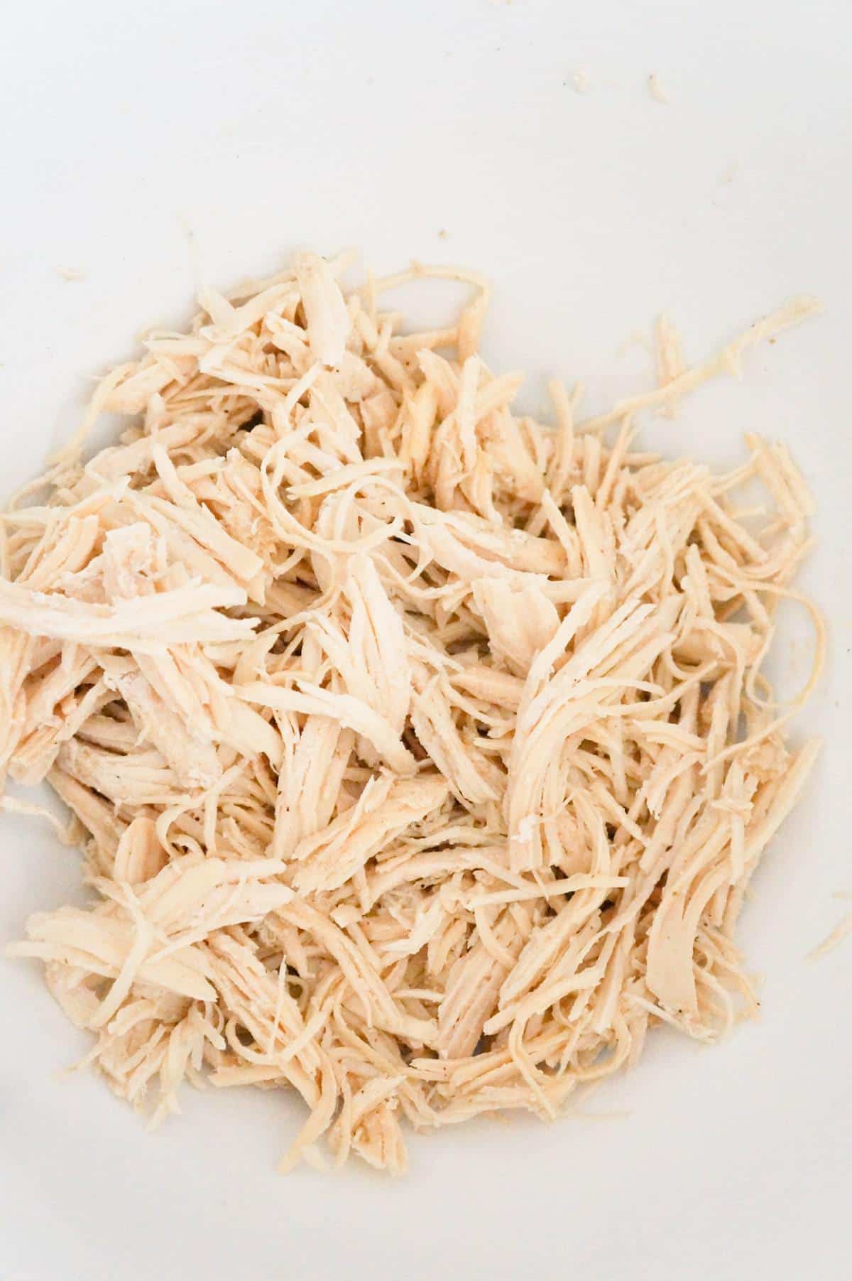 shredded chicken in a mixing bowl