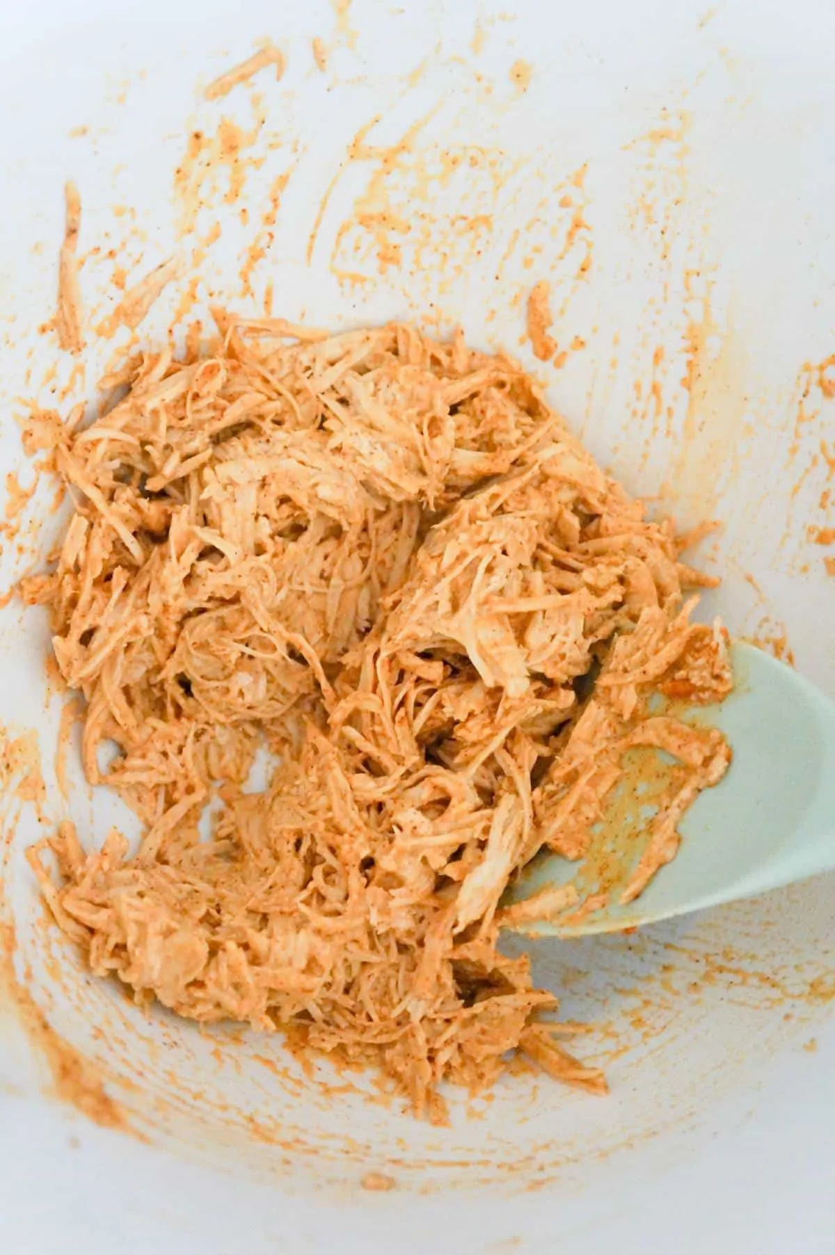 shredded chicken, mayo and taco seasoning mixture in a mixing bowl