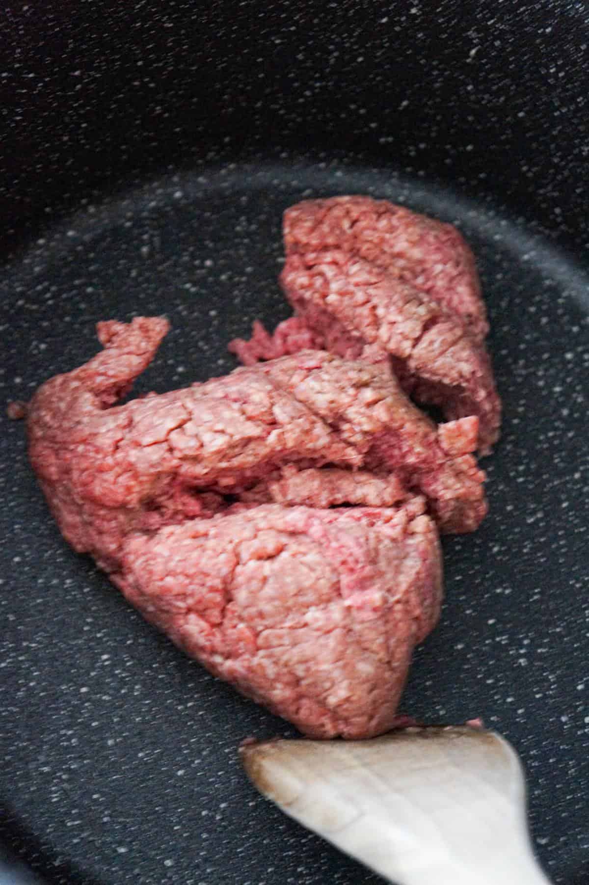 raw ground beef in a large pot