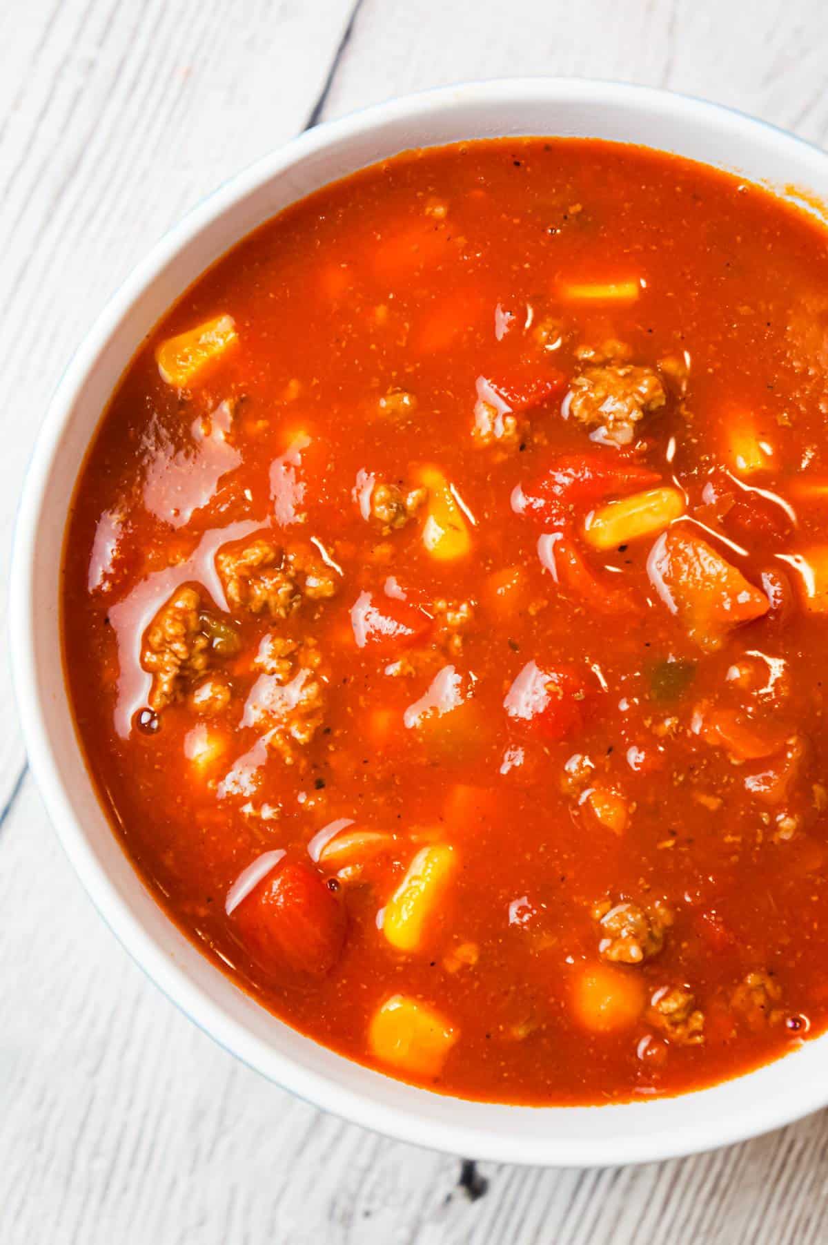 Easy Taco Soup is a hearty soup recipe loaded with ground beef, taco seasoning, salsa, Rotel, mixed beans and corn.