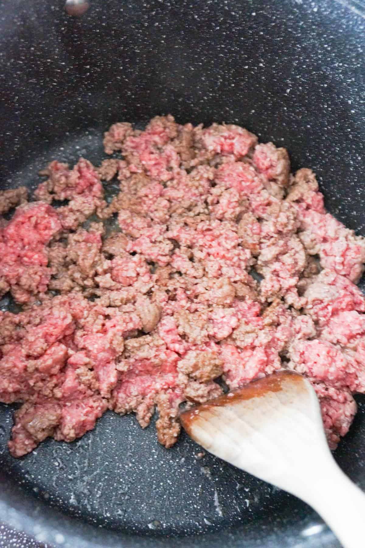 ground beef cooking in a large pot