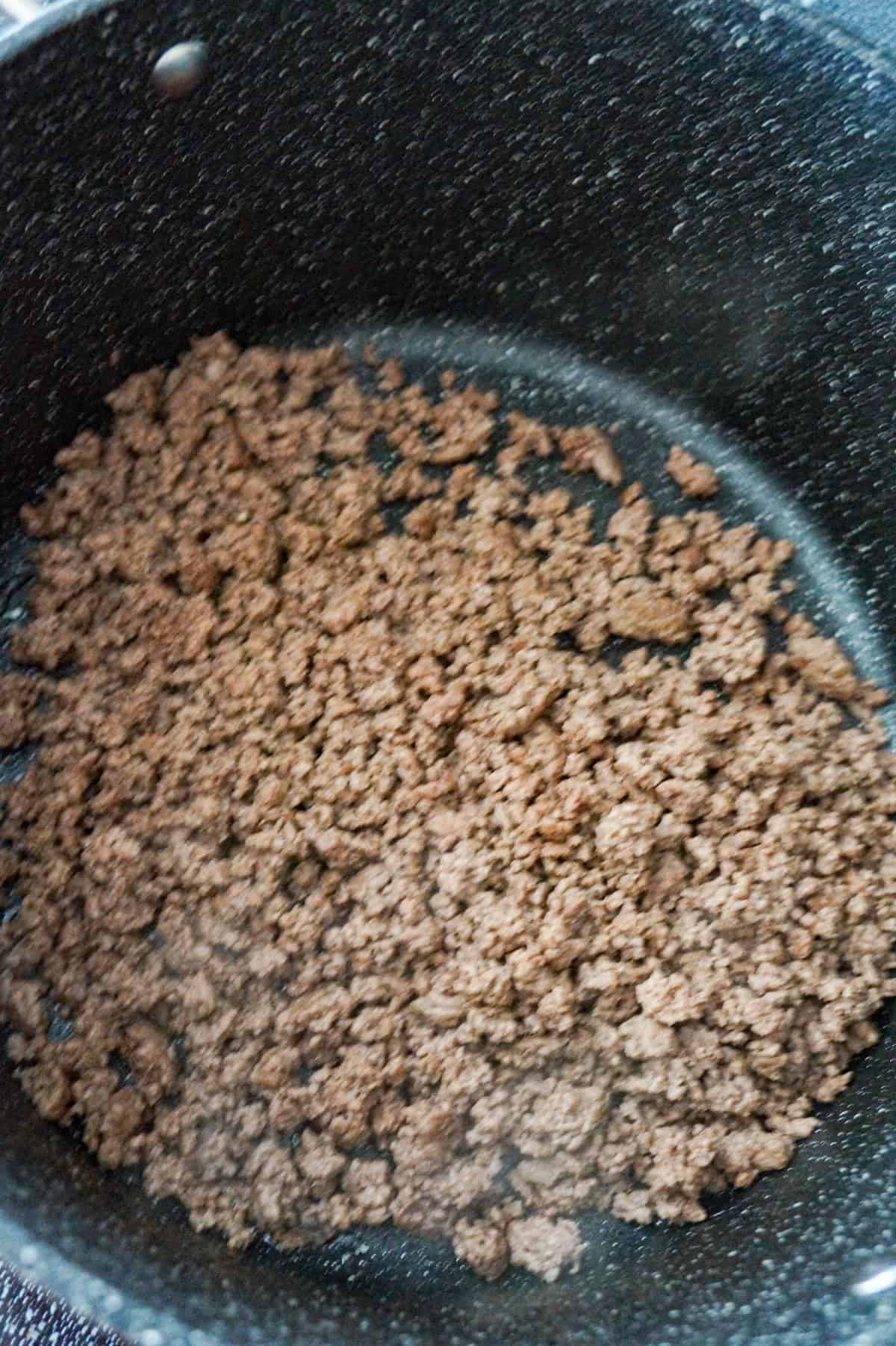 cooked ground beef in a large pot