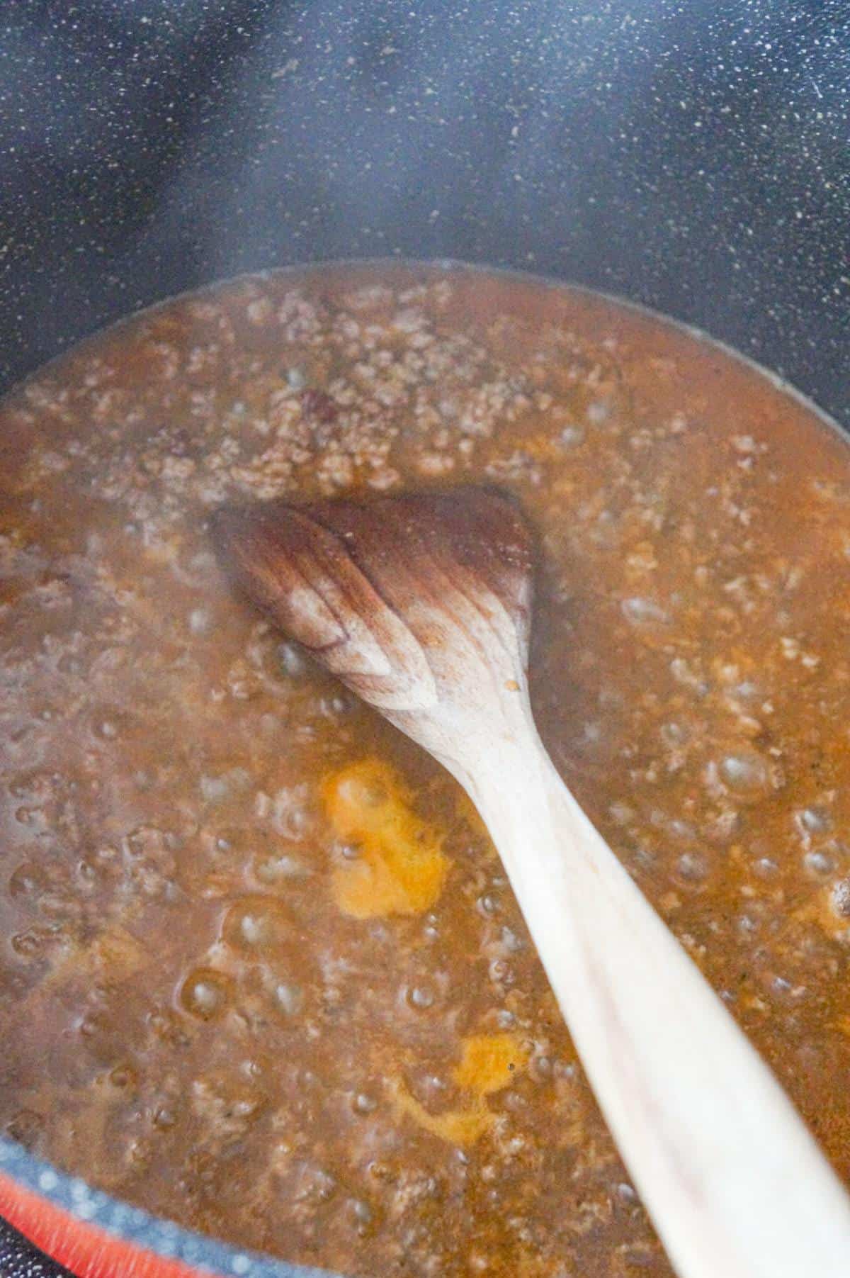 ground beef, water and taco seasoning in a large pot