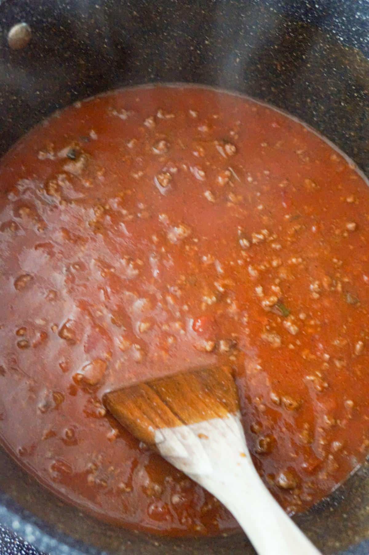 tomato sauce and ground beef mixture in a large pot