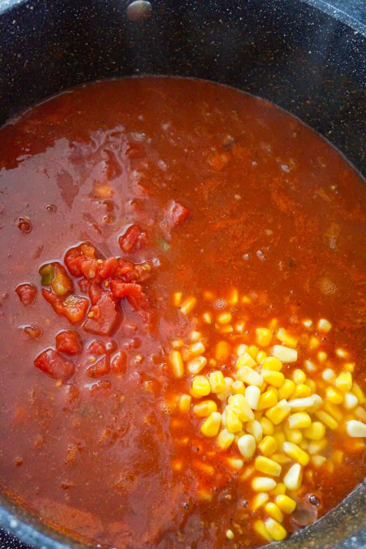 corn, salsa and Rotel added to taco soup mixture in a large pot