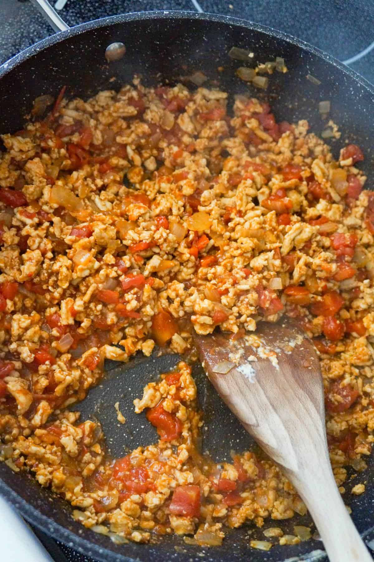 ground chicken and Rotel mixture in a saute pan