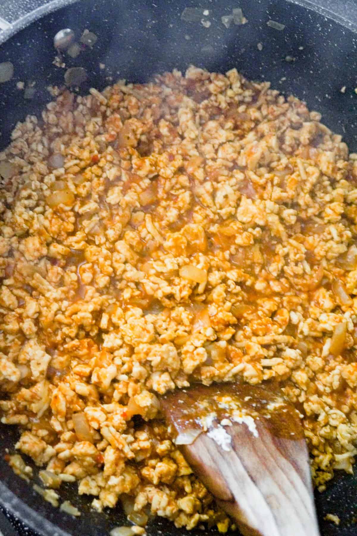 ground chicken taco meat simmering in a saute pan