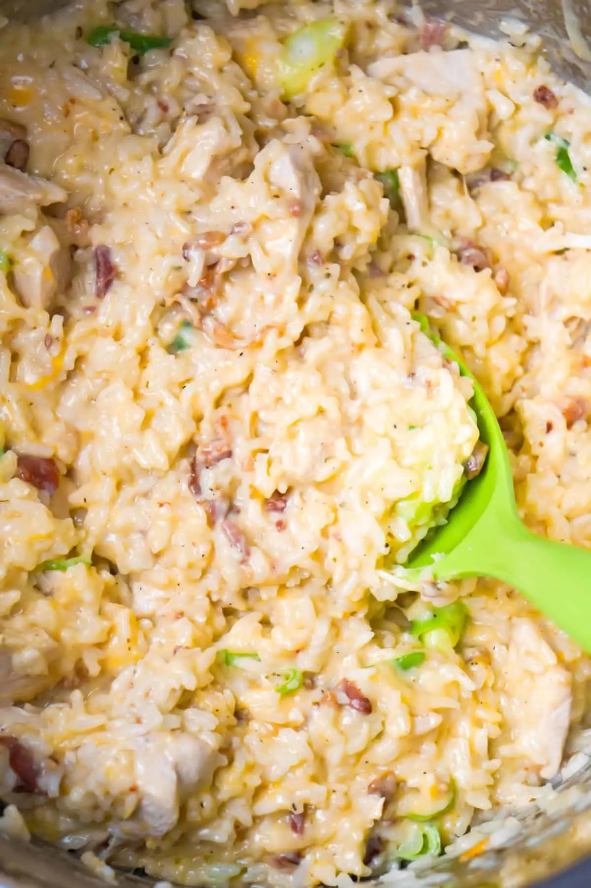 Instant Pot Cheddar Bacon Ranch Chicken and Rice is an easy pressure cooker dinner recipe loaded with chicken breast chunks, crumbled bacon and shredded cheddar cheese.