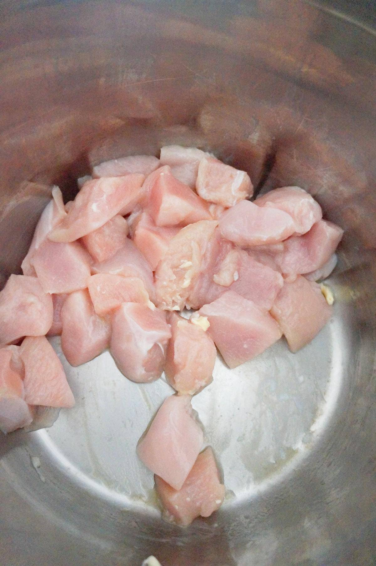 raw chicken breast chunks in an Instant Pot