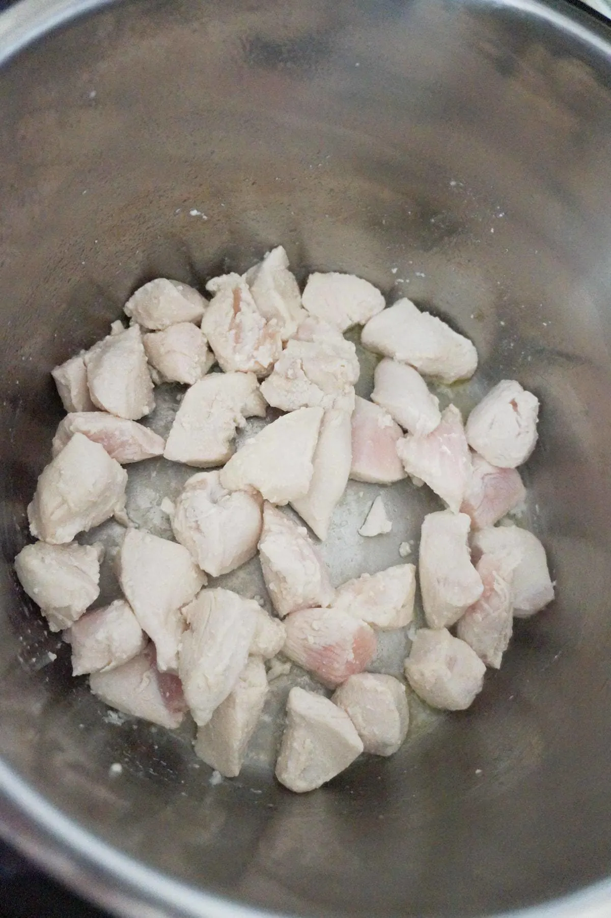 chicken breast chunks cooking in an Instant Pot