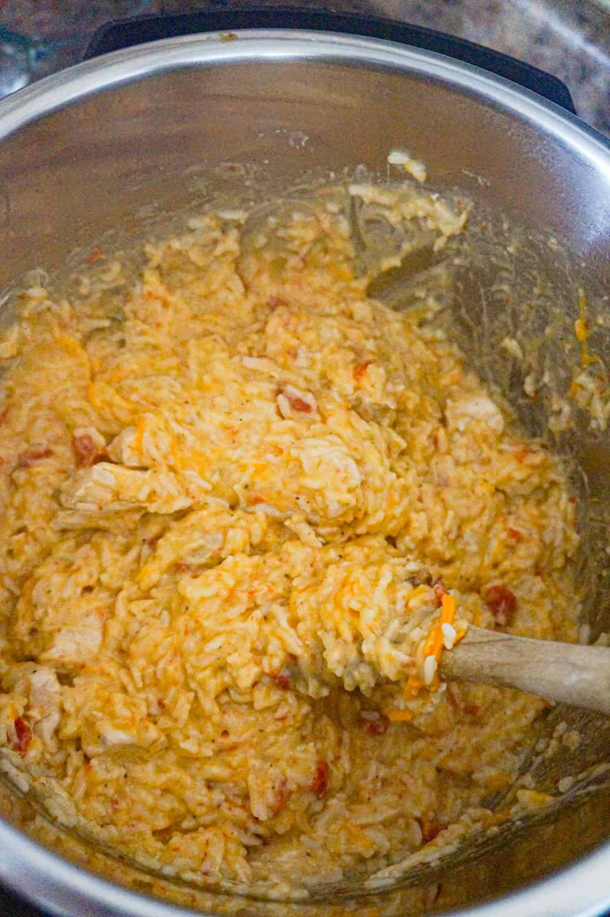 Instant Pot Cheesy Chicken and Rice is an easy pressure cooker dinner recipe made with long grain white rice and loaded with chunks of boneless, skinless chicken breasts and shredded cheese.