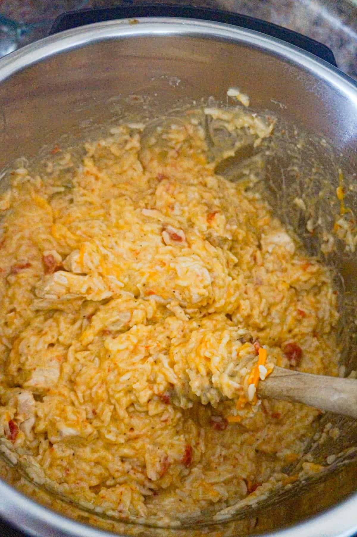 Instant Pot Cheesy Chicken and Rice is an easy pressure cooker dinner recipe made with long grain white rice and loaded with chunks of boneless, skinless chicken breasts and shredded cheese.