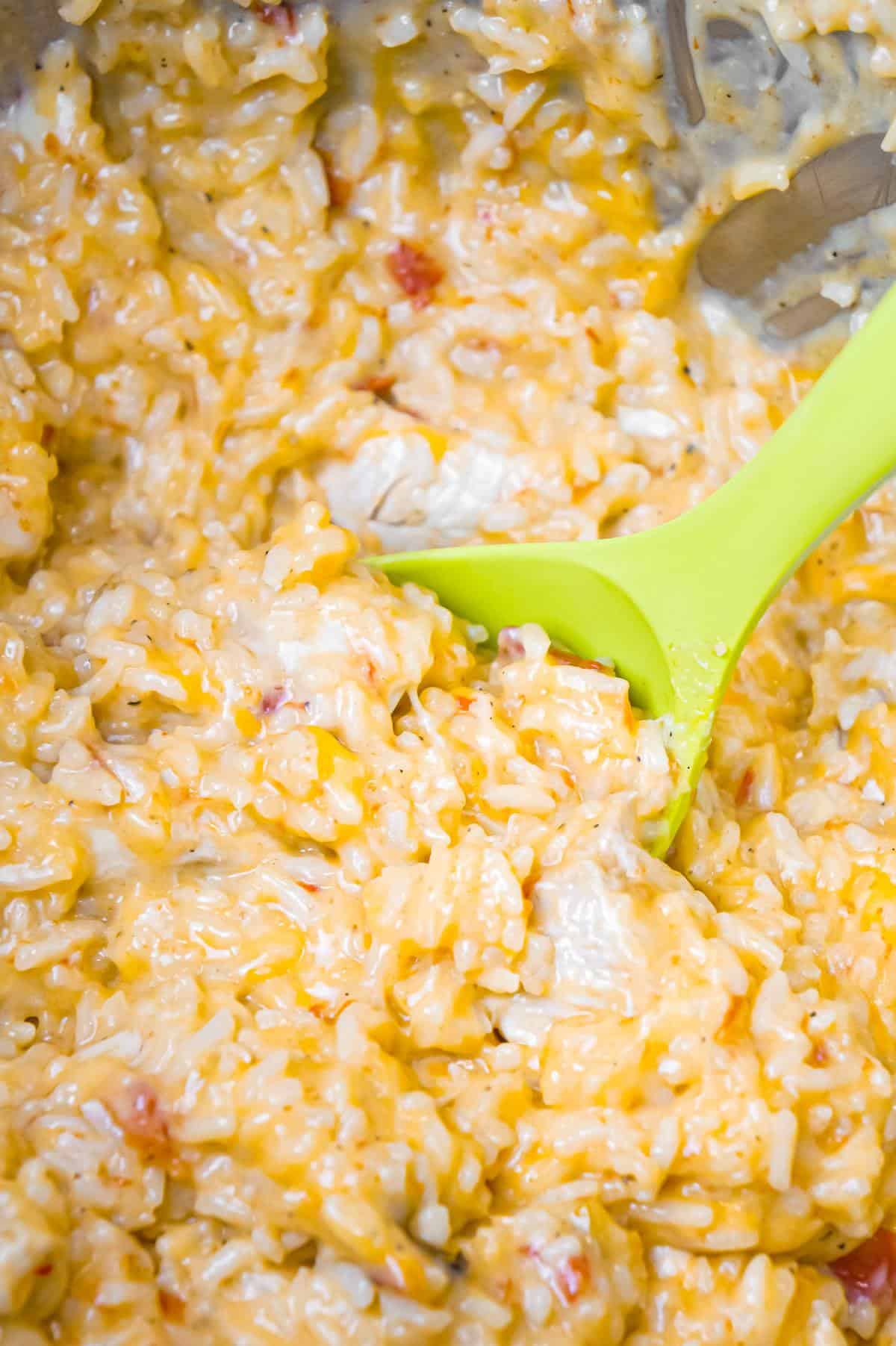 Instant Pot Cheesy Chicken and Rice is an easy pressure cooker dinner recipe made with long grain white rice and loaded with chunks of boneless, skinless chicken breasts and shredded cheese.