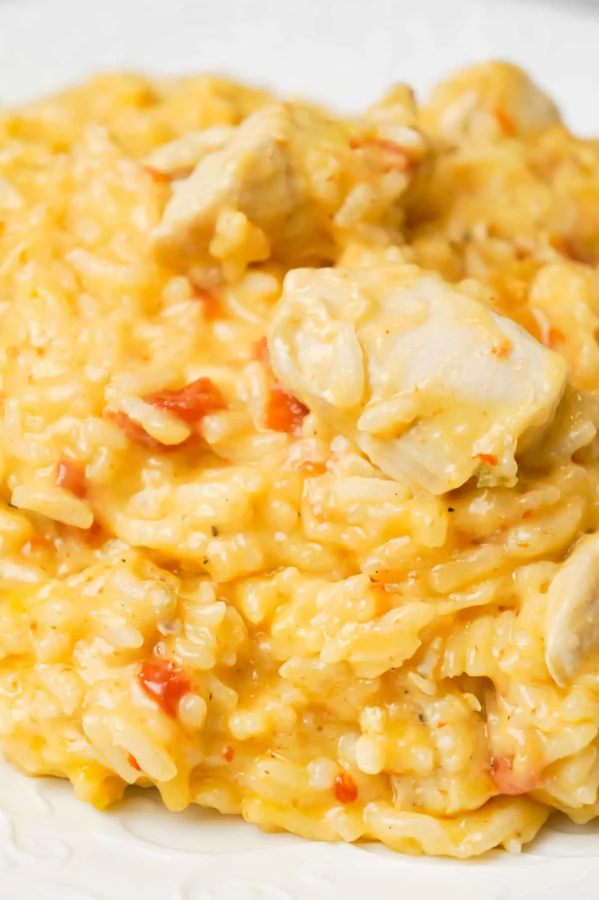 Instant Pot Cheesy Chicken and Rice is an easy pressure cooker dinner recipe made with long grain white rice and loaded with chunks of boneless, skinless chicken breasts and shredded cheese.