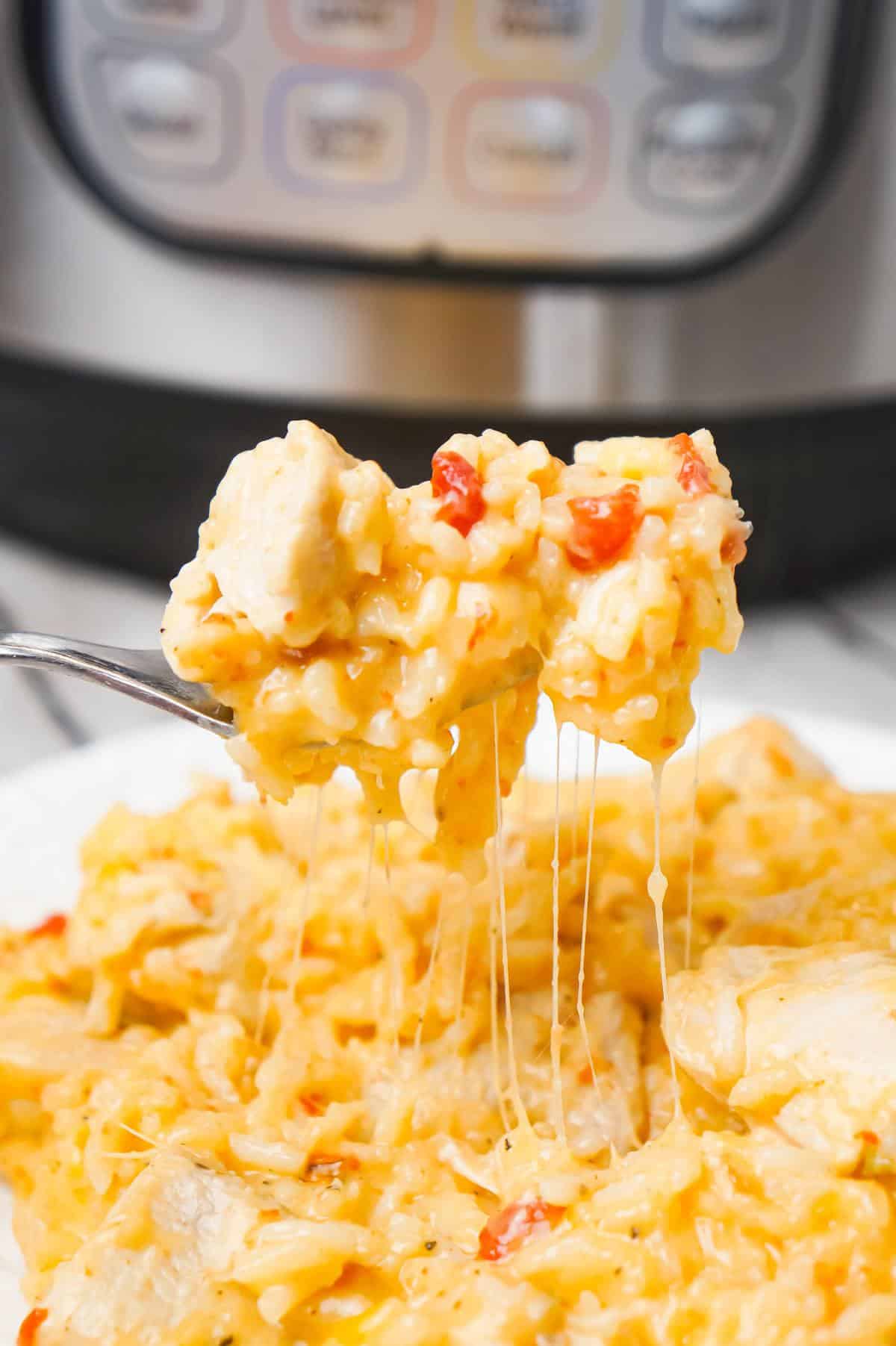 Instant Pot Cheesy Chicken and Rice is an easy pressure cooker dinner recipe made with long grain white rice and loaded with chunks of boneless, skinless chicken breasts and shredded cheese.